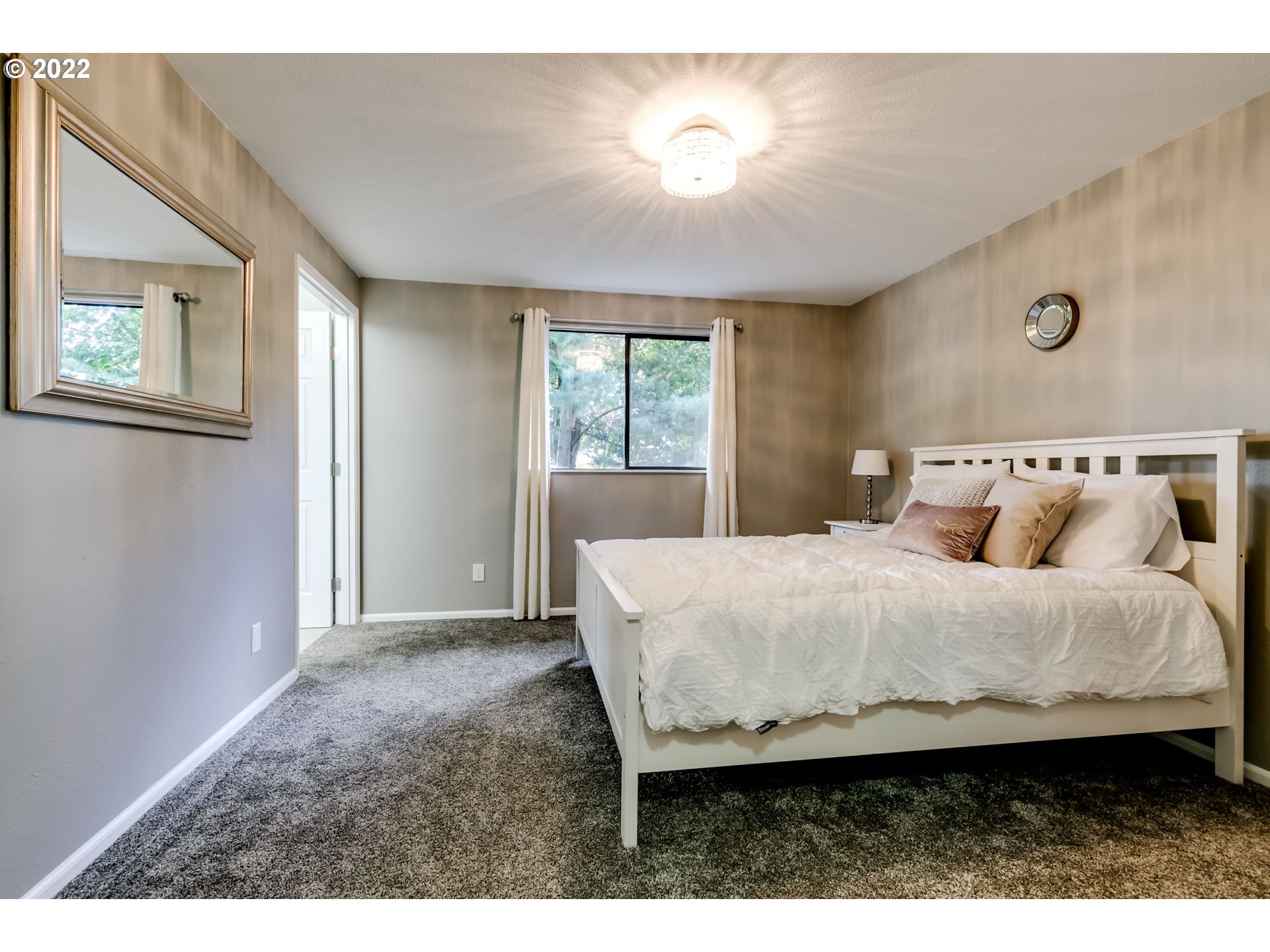 610 67th Place Springfield, OR 97478 - Photo 21 of 28 a bed sitting in a bedroom next to a window