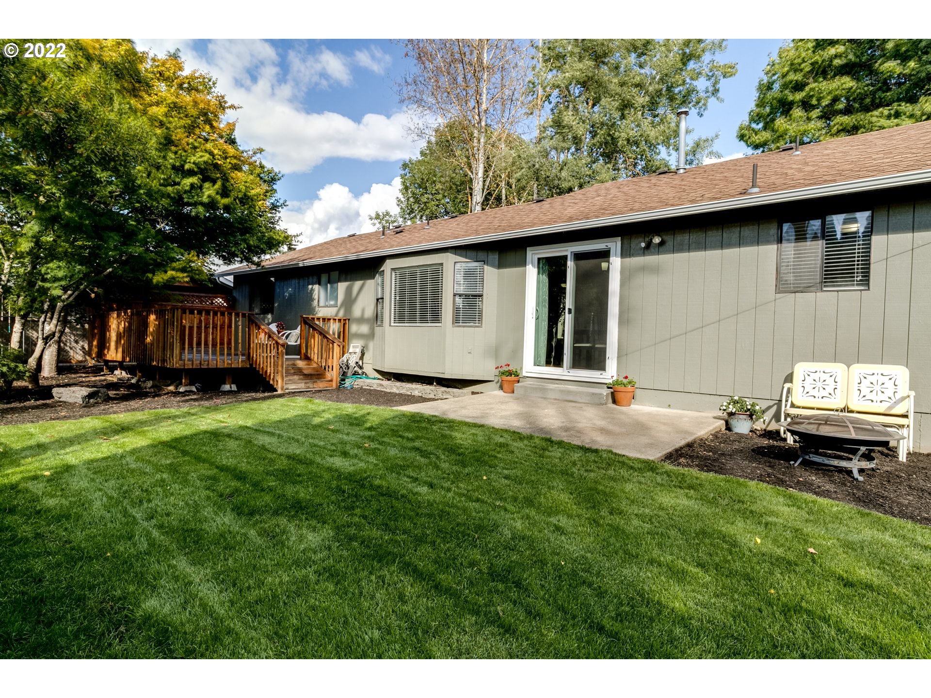 610 67th Place Springfield, OR 97478 - Photo 25 of 28 a front view of a house with a garden and trees
