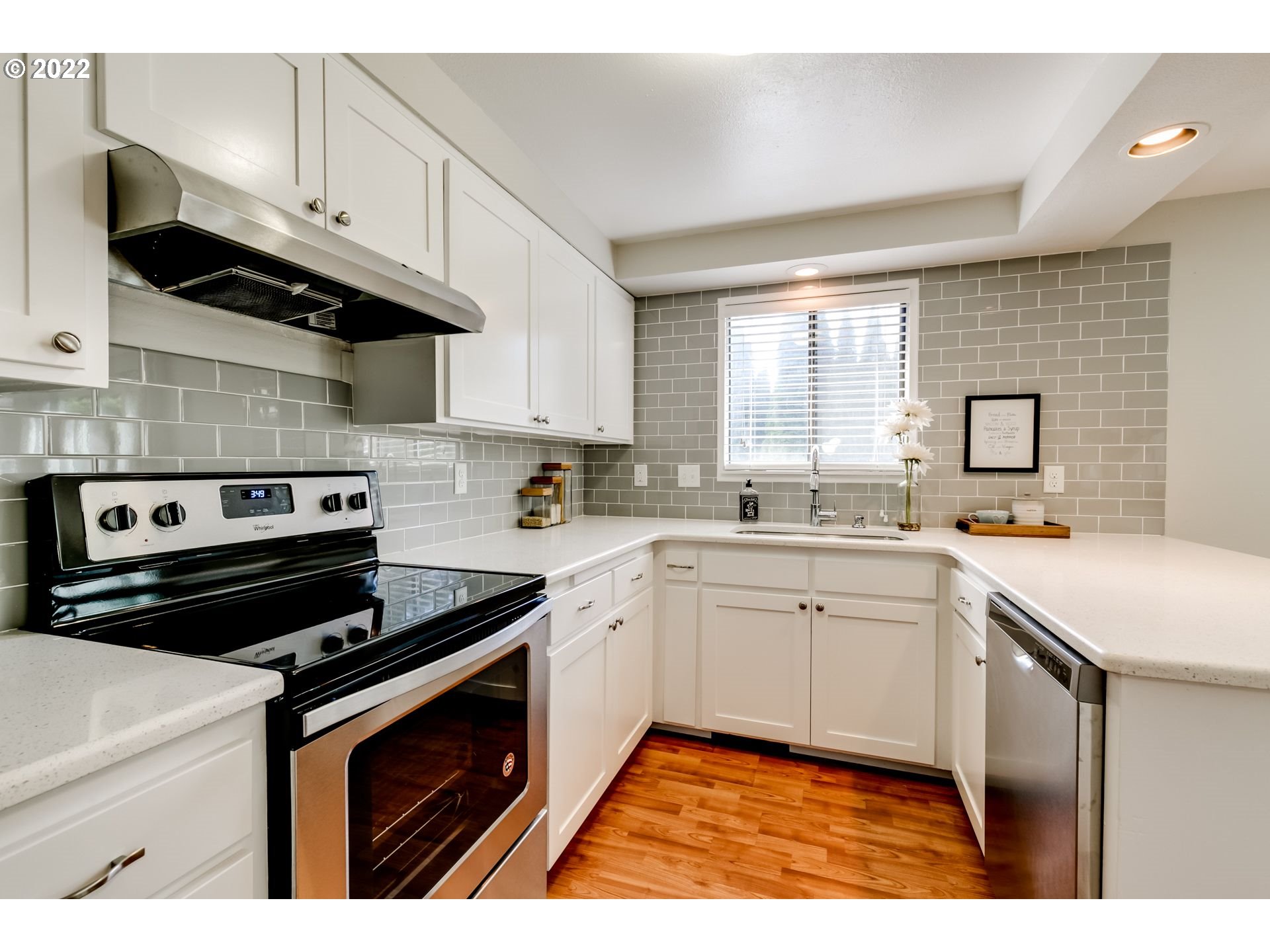 610 67th Place Springfield, OR 97478 - Photo 5 of 28 a kitchen with a sink stove and cabinets
