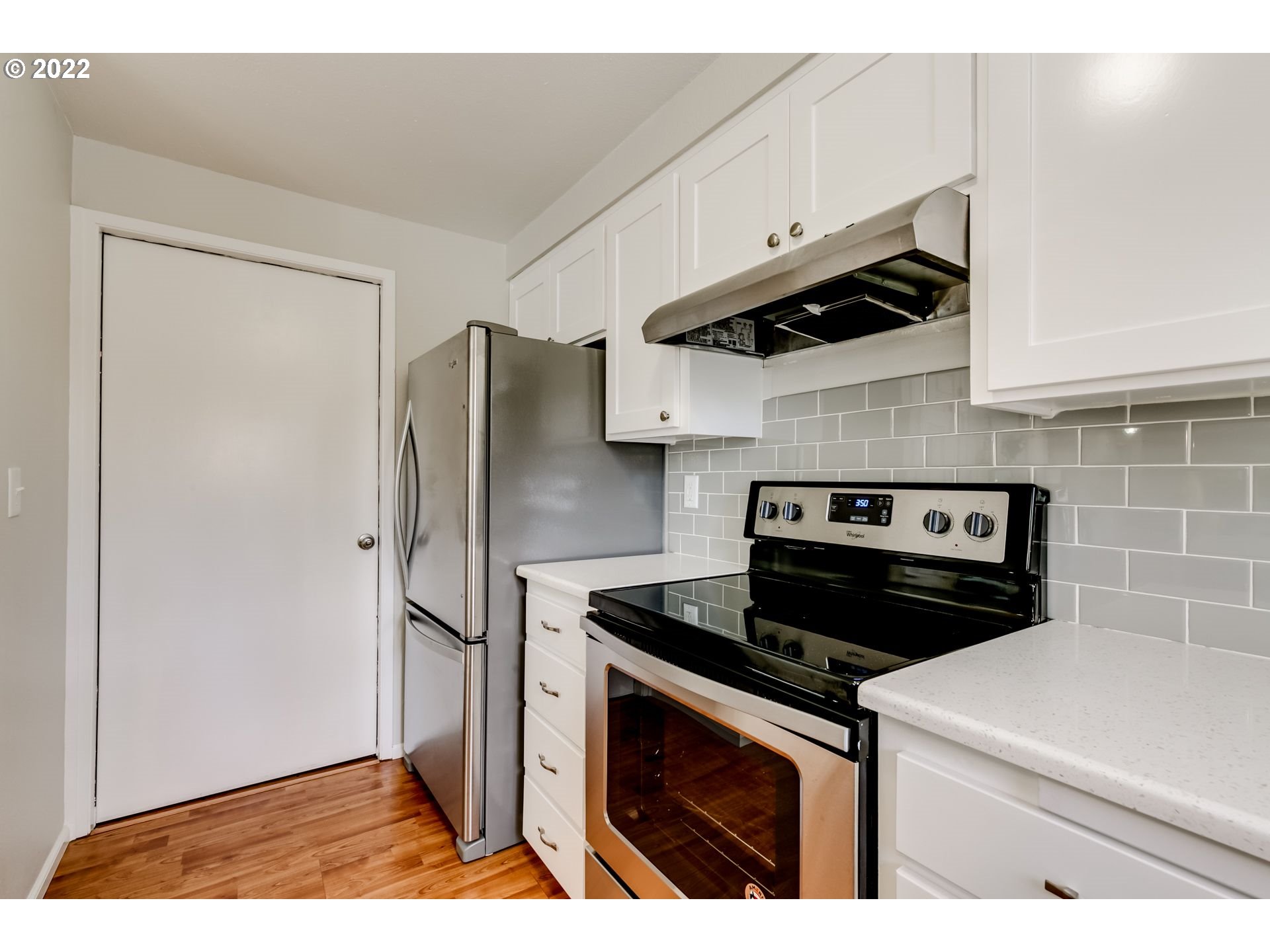 610 67th Place Springfield, OR 97478 - Photo 6 of 28 a kitchen with stainless steel appliances a refrigerator a stove and cabinets