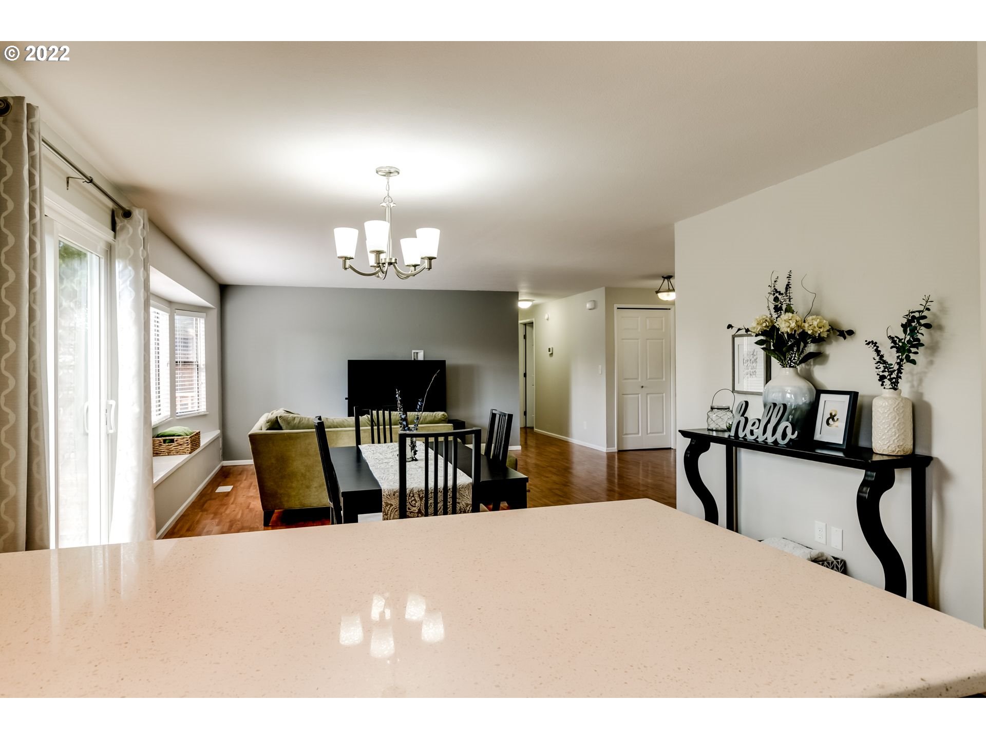 610 67th Place Springfield, OR 97478 - Photo 7 of 28 a living room with furniture a chandelier and a flat screen tv