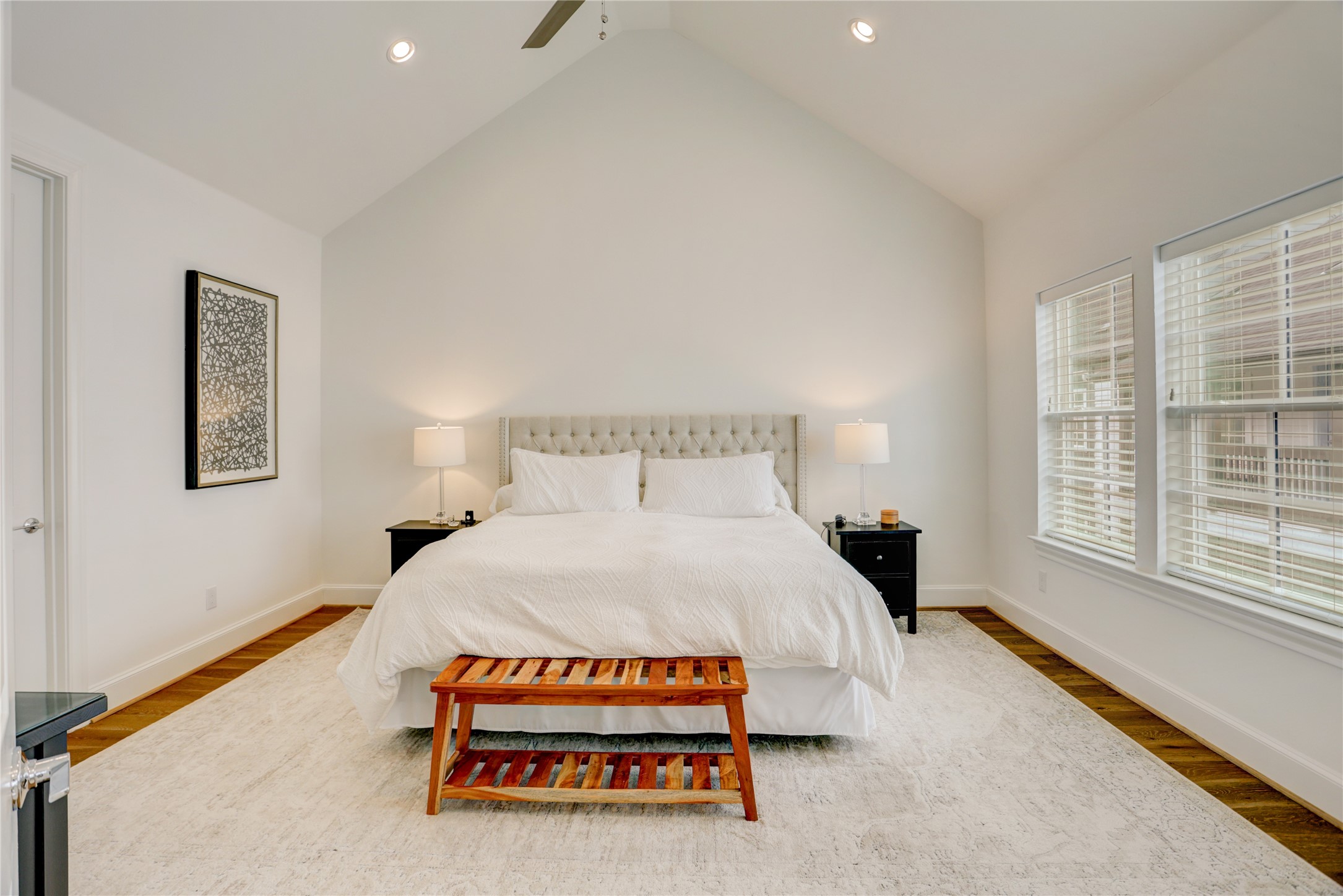 630 Delmar Street Houston, TX 77023 - Photo 15 of 27 a bedroom with a bed and a large window