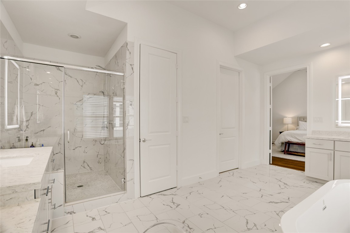 630 Delmar Street Houston, TX 77023 - Photo 16 of 27 a bathroom with a tub shower sink and mirror