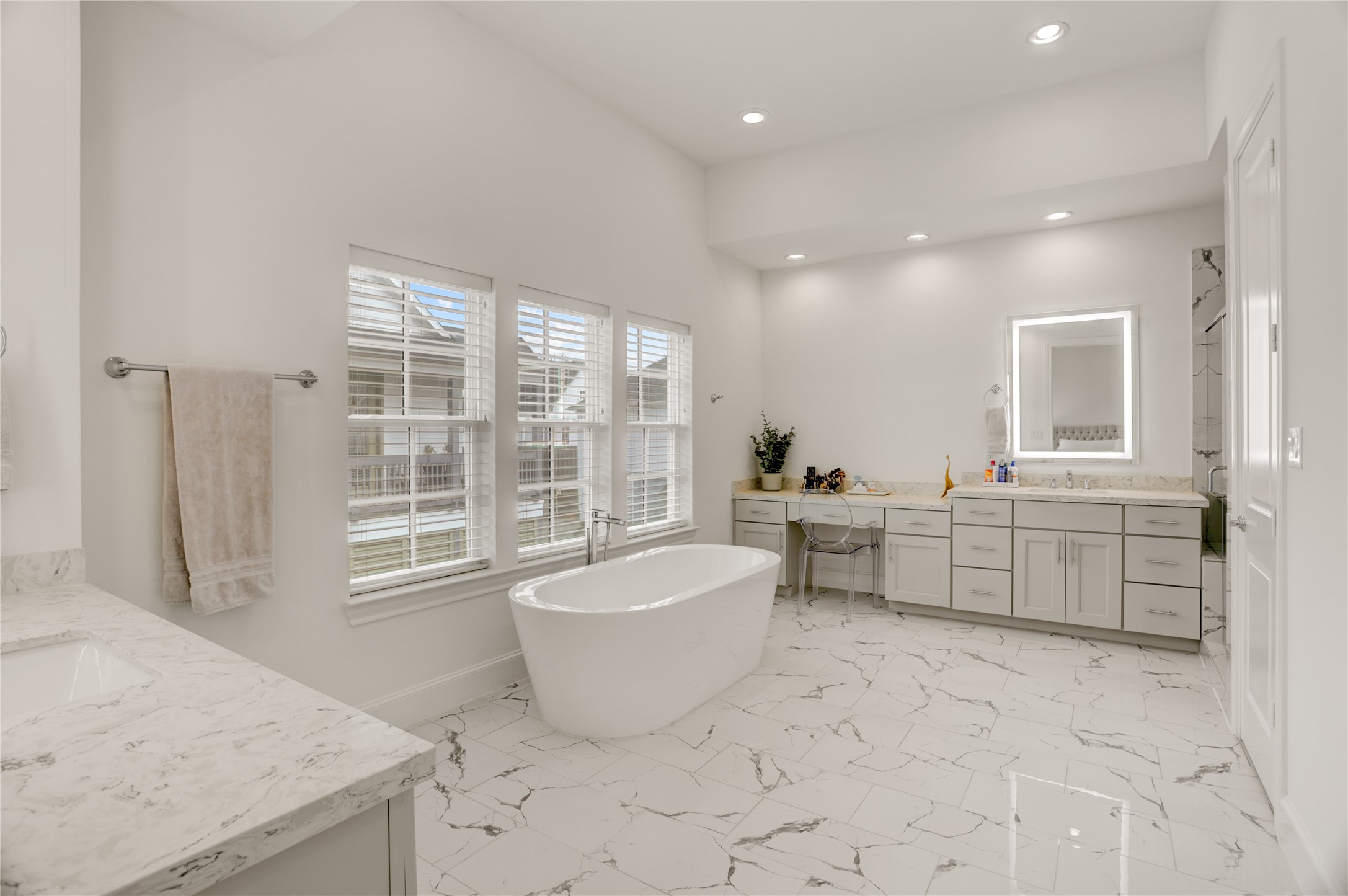 630 Delmar Street Houston, TX 77023 - Photo 18 of 27 a spacious bathroom with a granite countertop tub sink and mirror