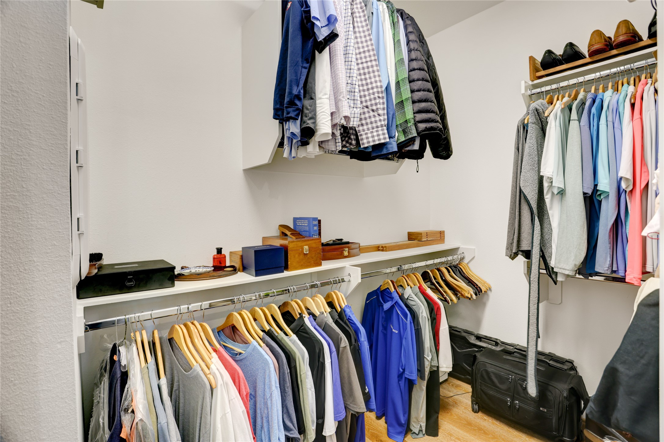 630 Delmar Street Houston, TX 77023 - Photo 19 of 27 a view of walk in closet with clothes and shoes