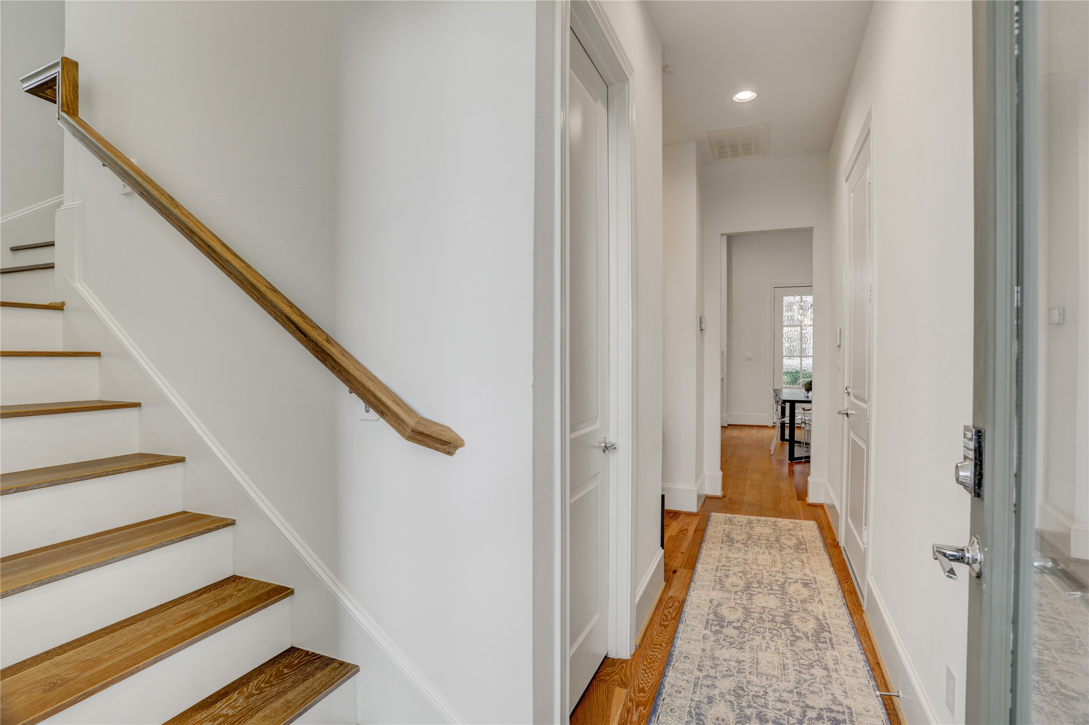 630 Delmar Street Houston, TX 77023 - Photo 27 of 27 a view of a hallway with wooden floor and staircase
