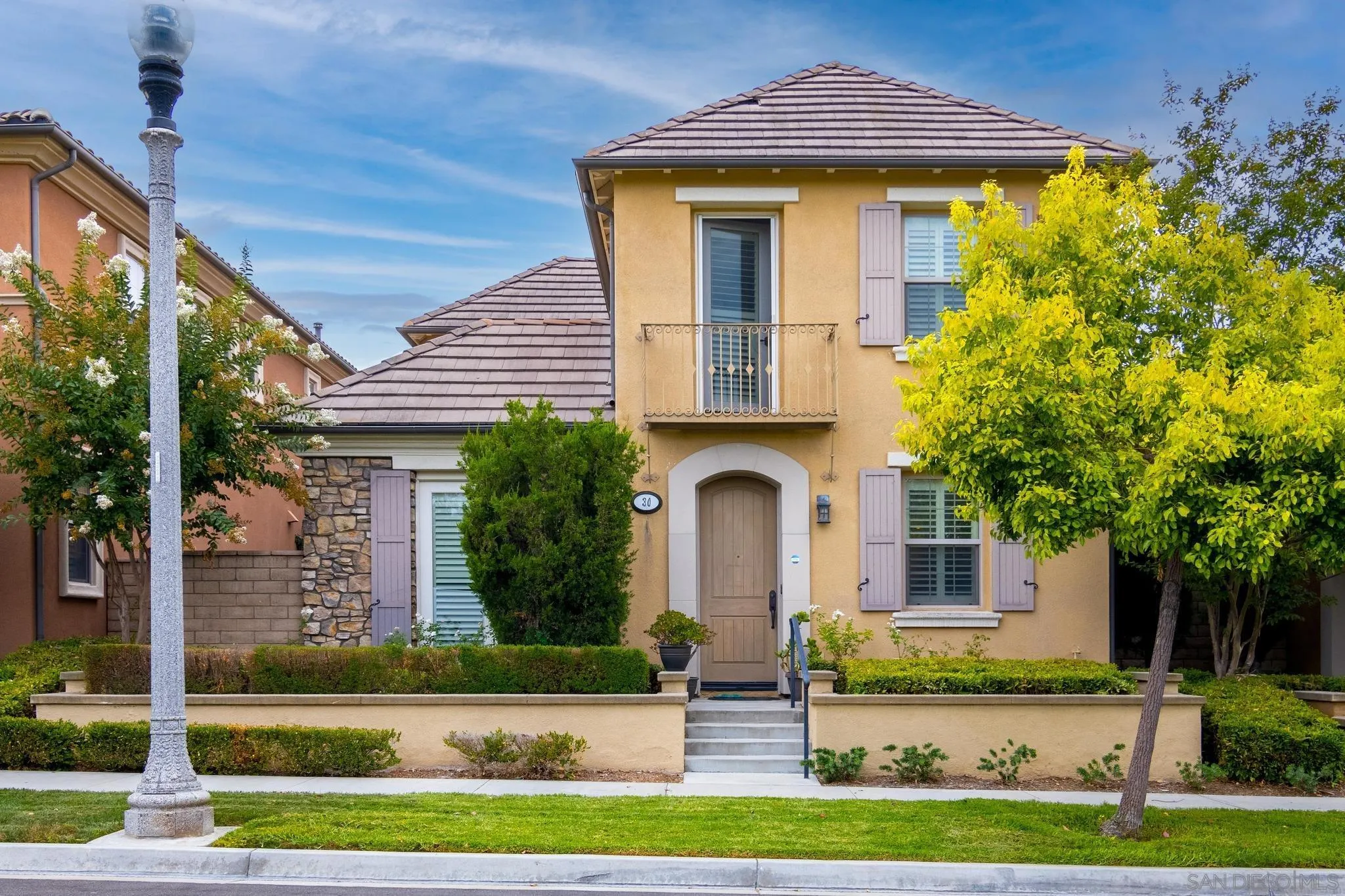 30 Long Fellow Irvine, CA 92620 - Photo 13 of 43 a front view of a house with garden