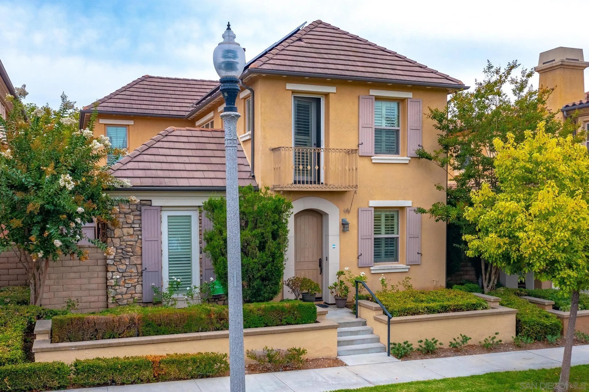 30 Long Fellow Irvine, CA 92620 - Photo 14 of 43 a front view of a house with a yard