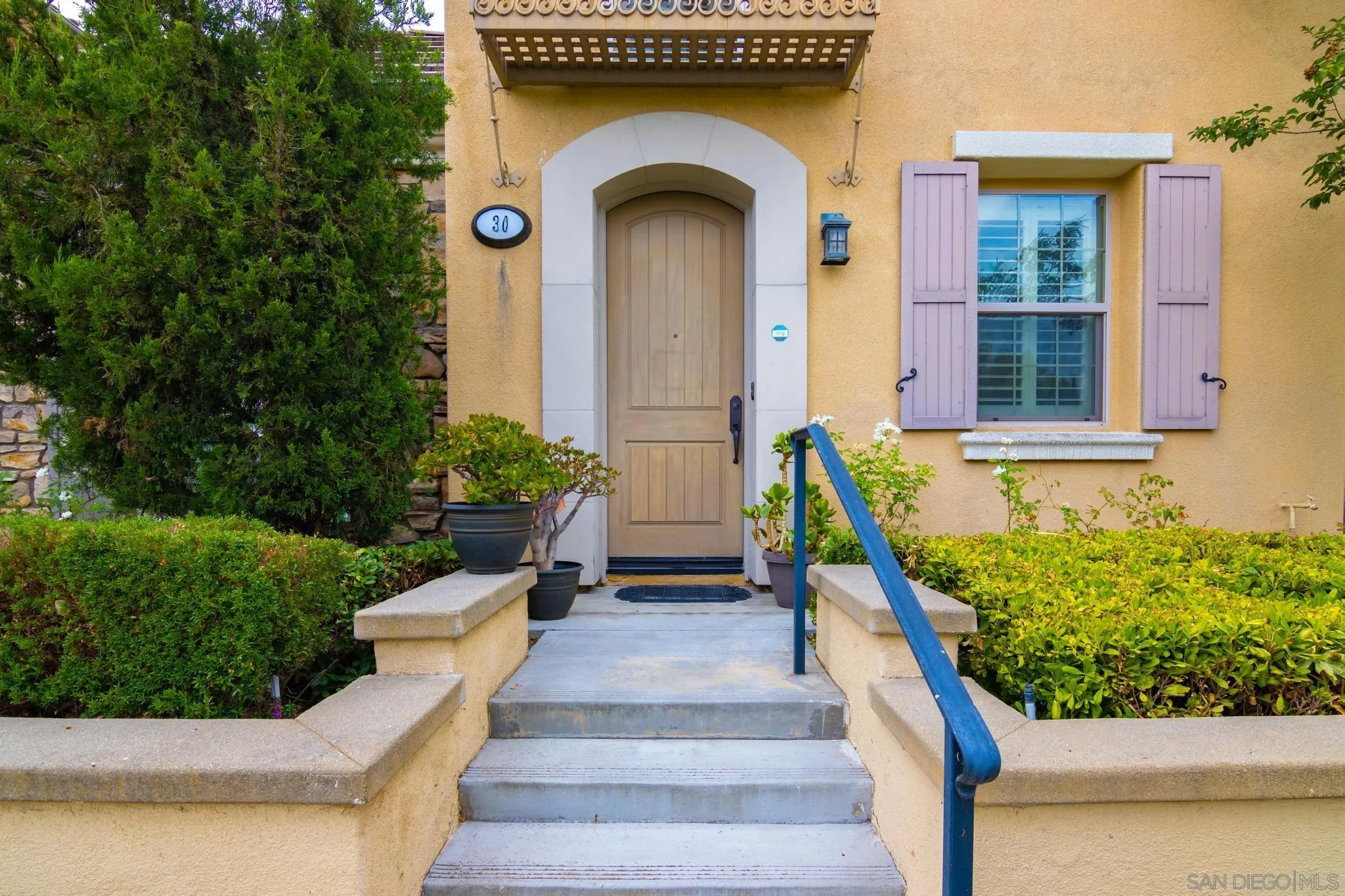 30 Long Fellow Irvine, CA 92620 - Photo 16 of 43 a front view of a house with outdoor garden and plants