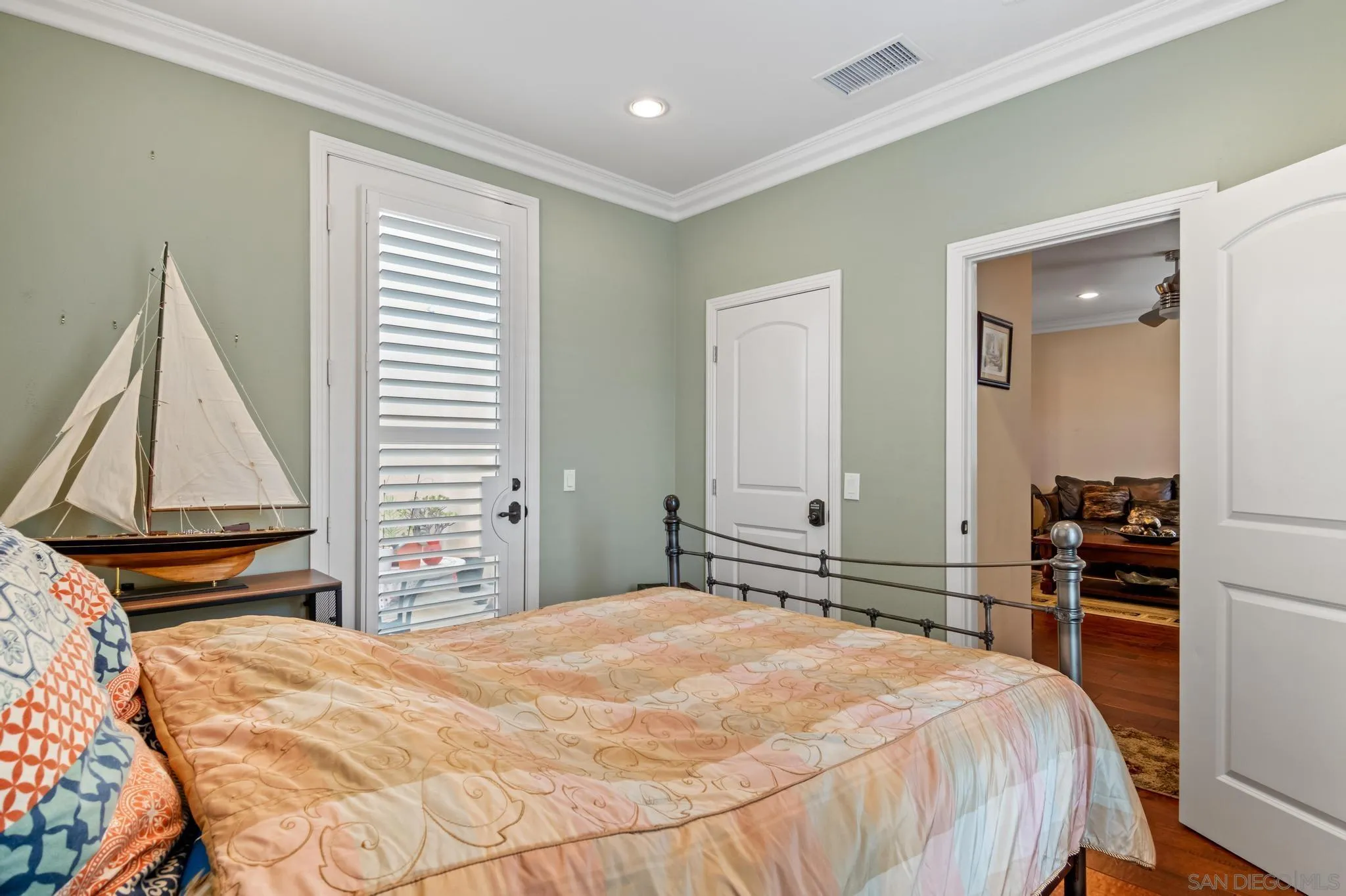 30 Long Fellow Irvine, CA 92620 - Photo 19 of 43 a bedroom with a bed and wooden floor