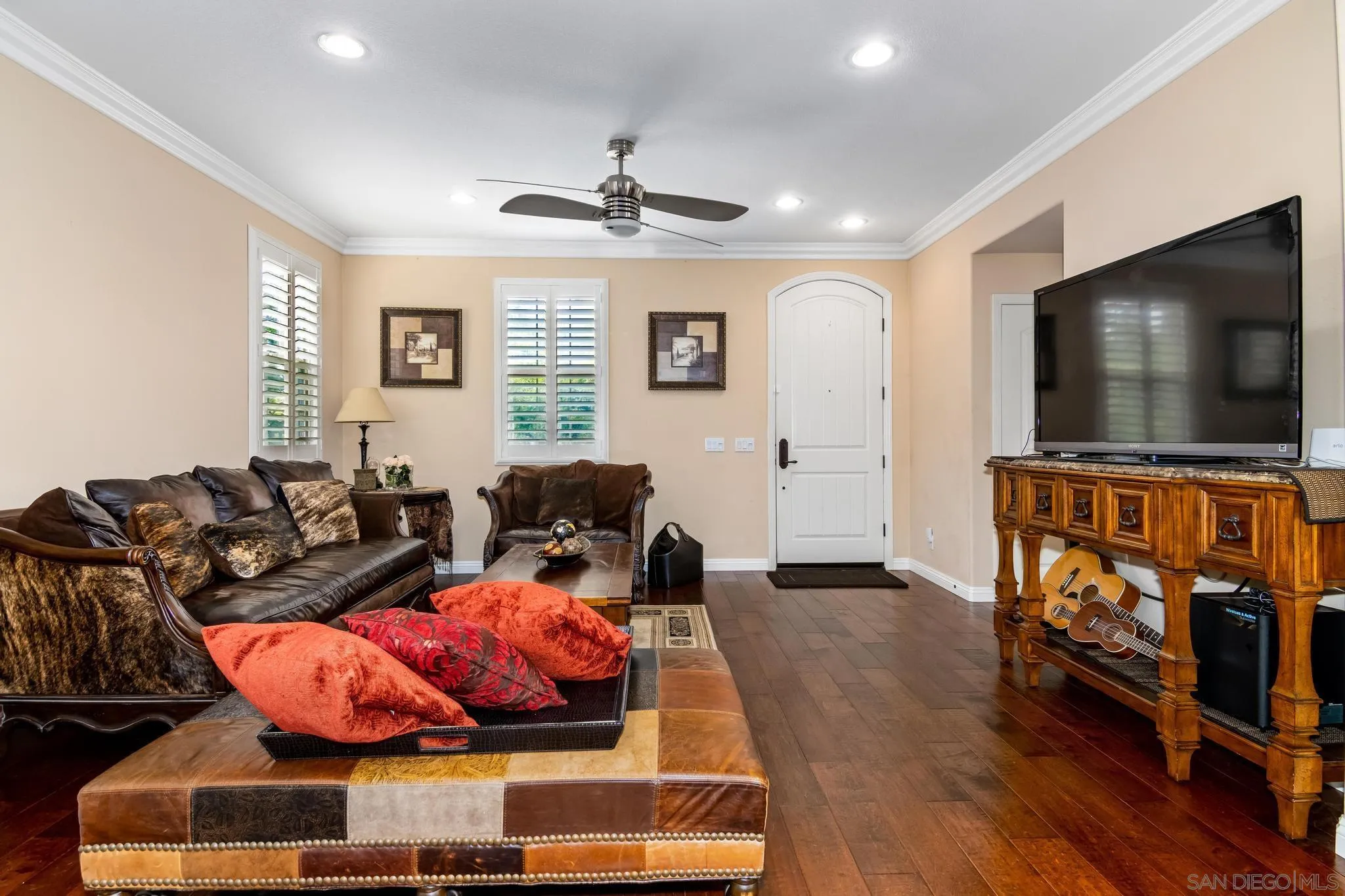 30 Long Fellow Irvine, CA 92620 - Photo 20 of 43 a living room with furniture and a flat screen tv