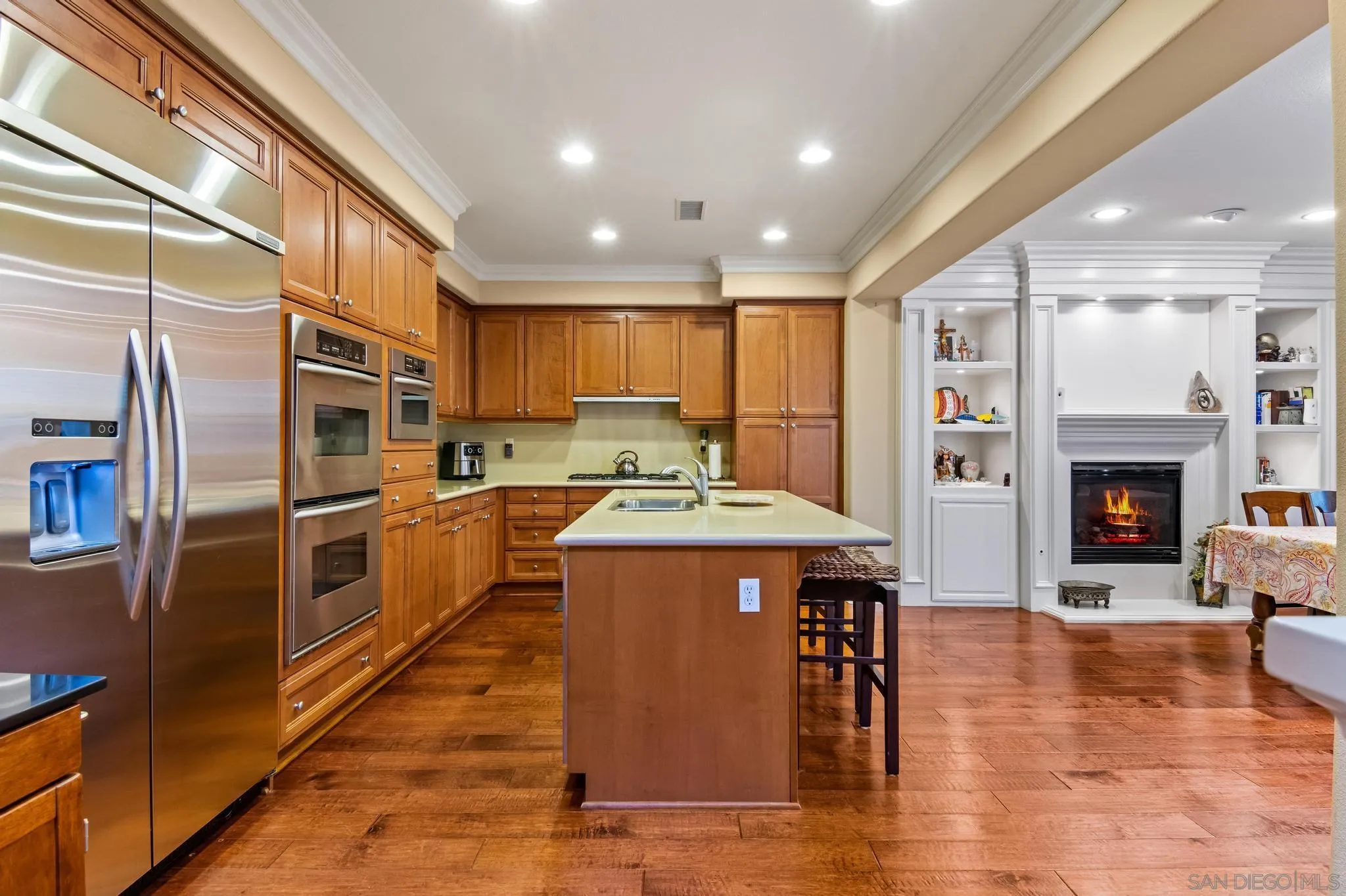 30 Long Fellow Irvine, CA 92620 - Photo 24 of 43 a kitchen with stainless steel appliances granite countertop a refrigerator a stove top oven a sink and a chairs