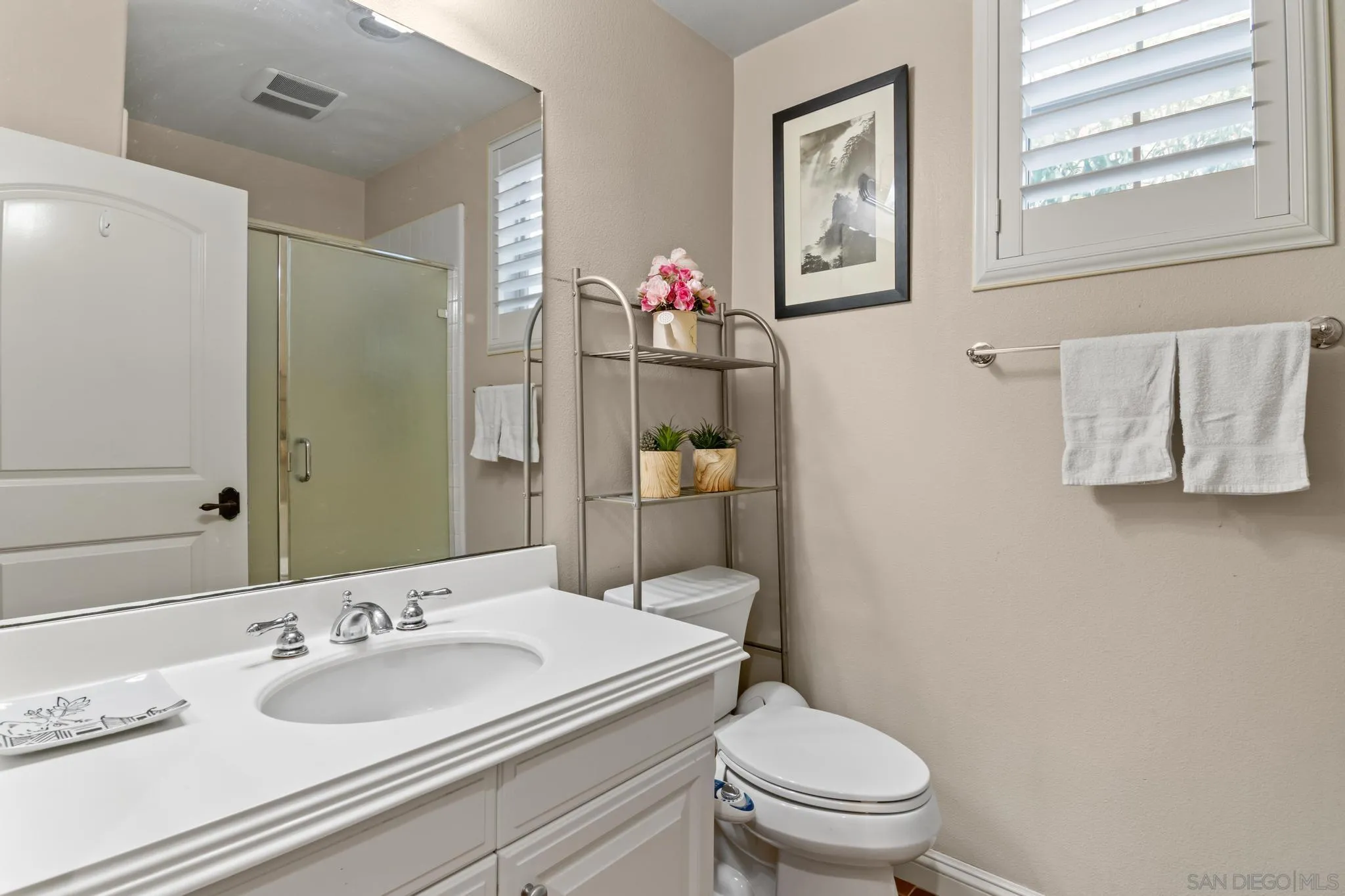 30 Long Fellow Irvine, CA 92620 - Photo 26 of 43 a bathroom with a toilet sink vanity and mirror