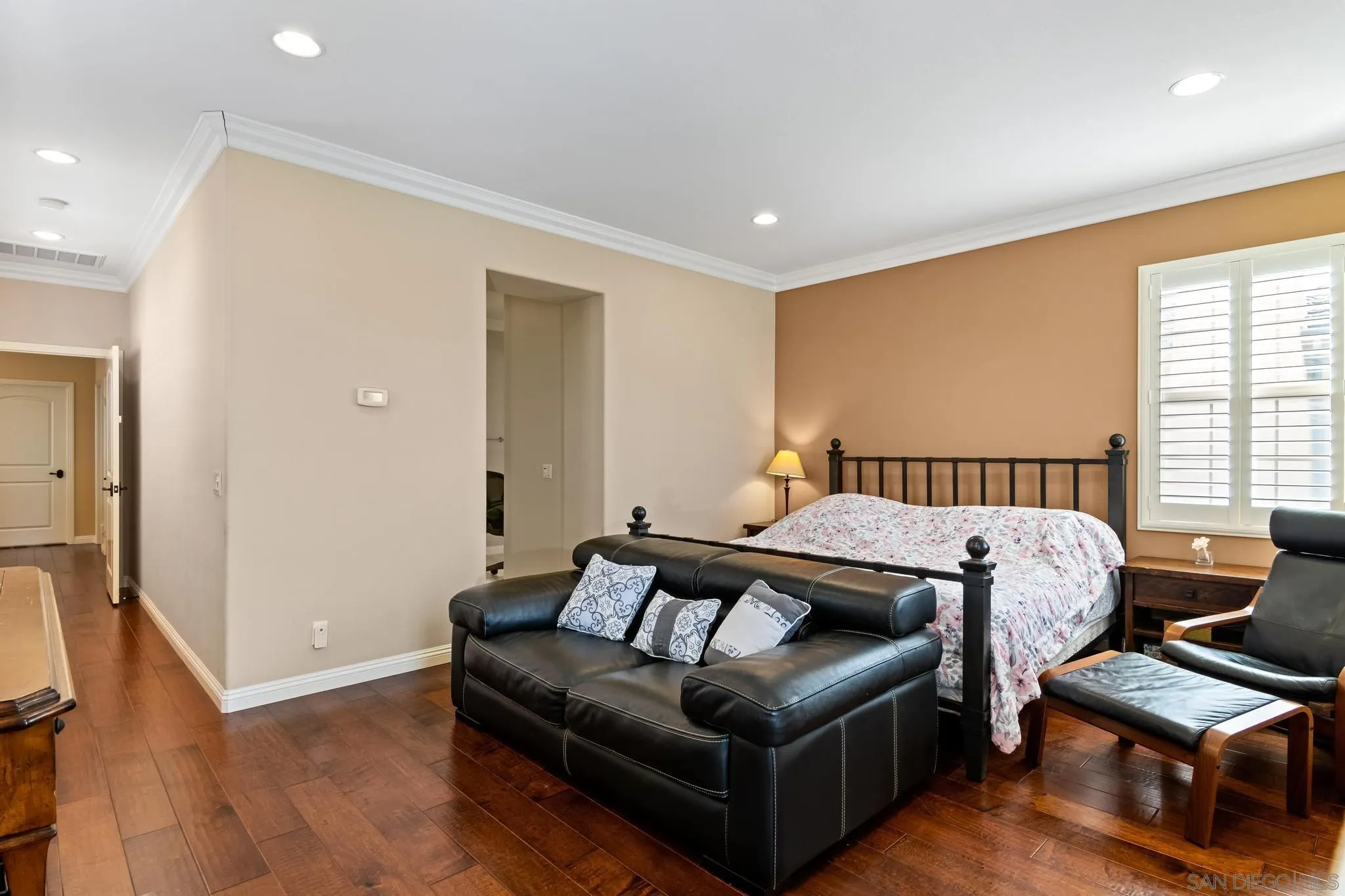 30 Long Fellow Irvine, CA 92620 - Photo 31 of 43 a spacious bedroom with a bed and a couch