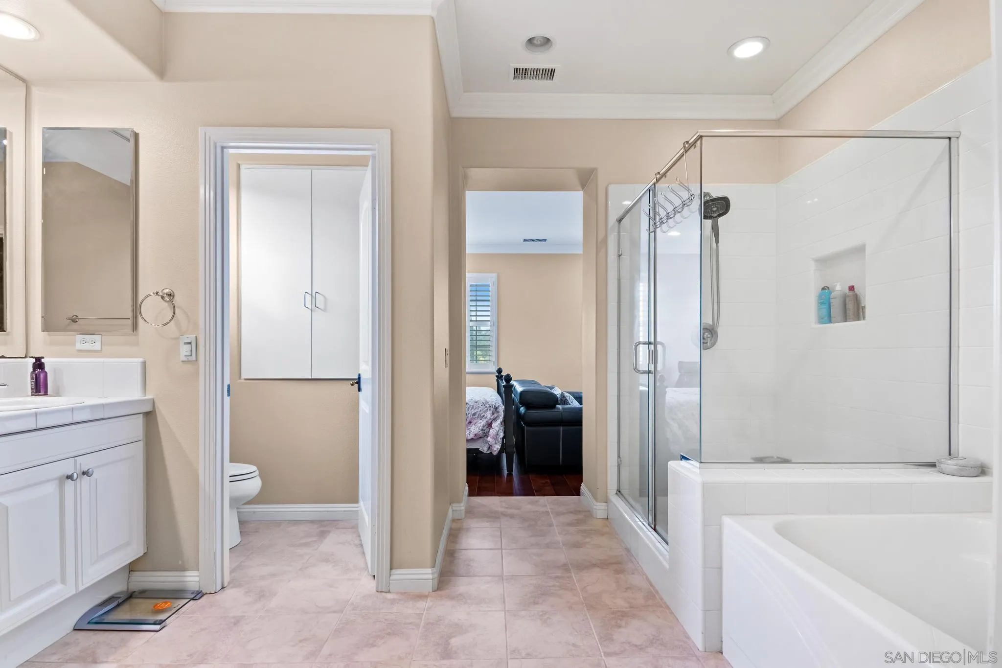 30 Long Fellow Irvine, CA 92620 - Photo 32 of 43 a bathroom with a tub shower sink vanity and a toilet