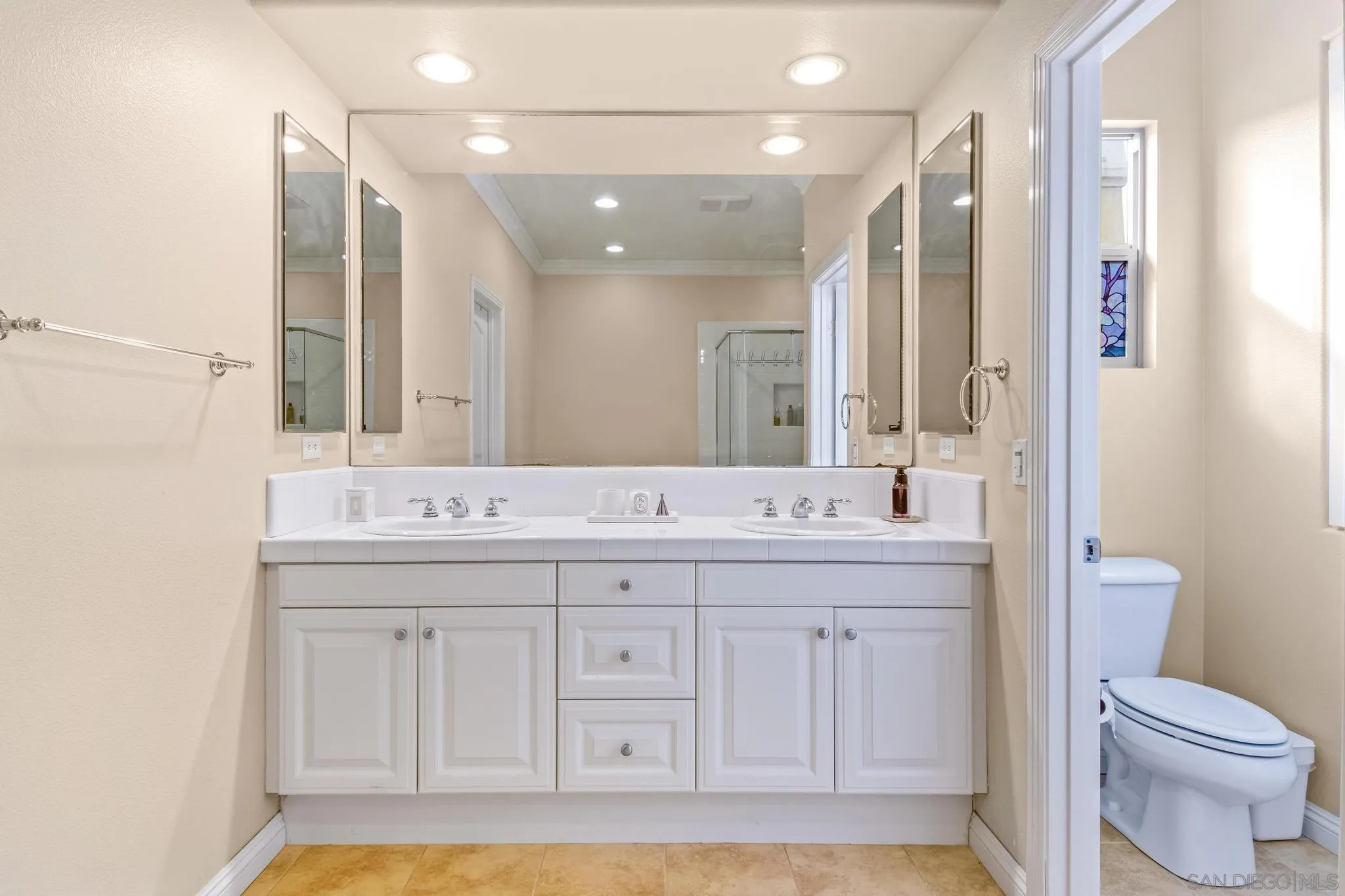 30 Long Fellow Irvine, CA 92620 - Photo 33 of 43 a bathroom with a sink a toilet and a mirror