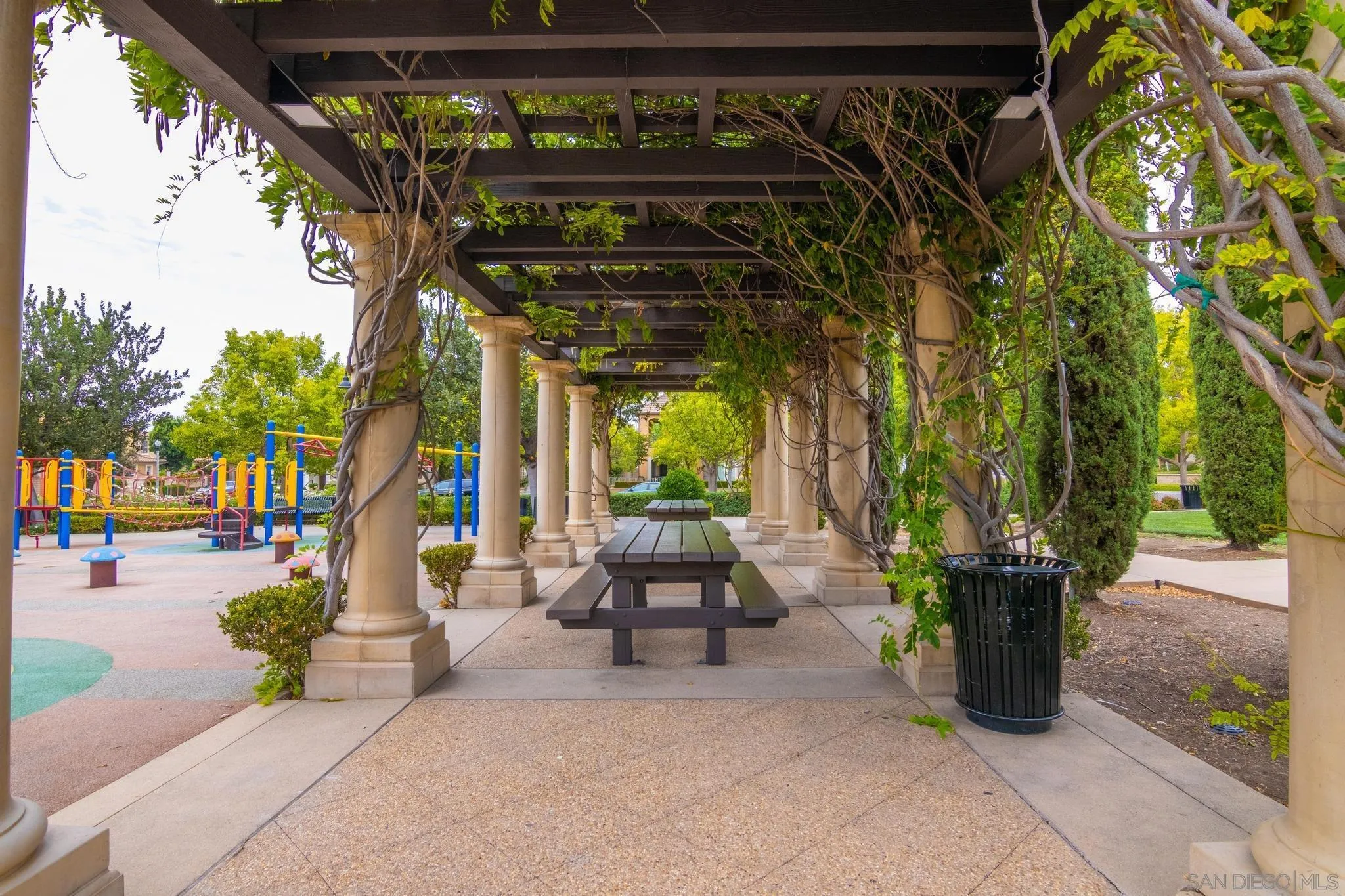 30 Long Fellow Irvine, CA 92620 - Photo 41 of 43 a view of a patio with table and chairs potted plants and palm trees