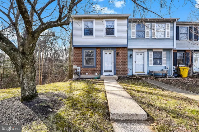 a view of a house with a wooden deck