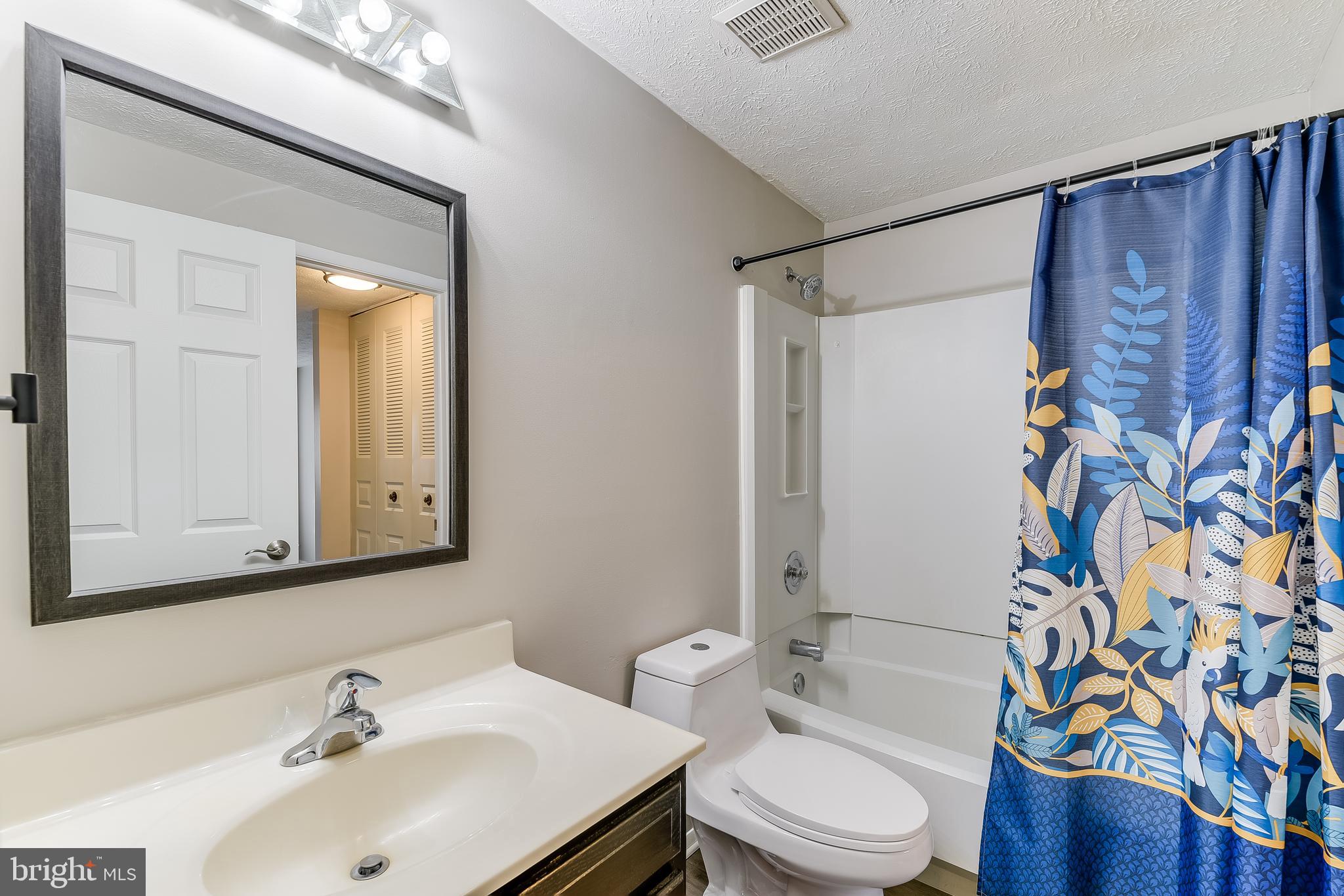 7946 Sutherland Court Pasadena, MD 21122 - Photo 23 of 37 a bathroom with a sink toilet and shower