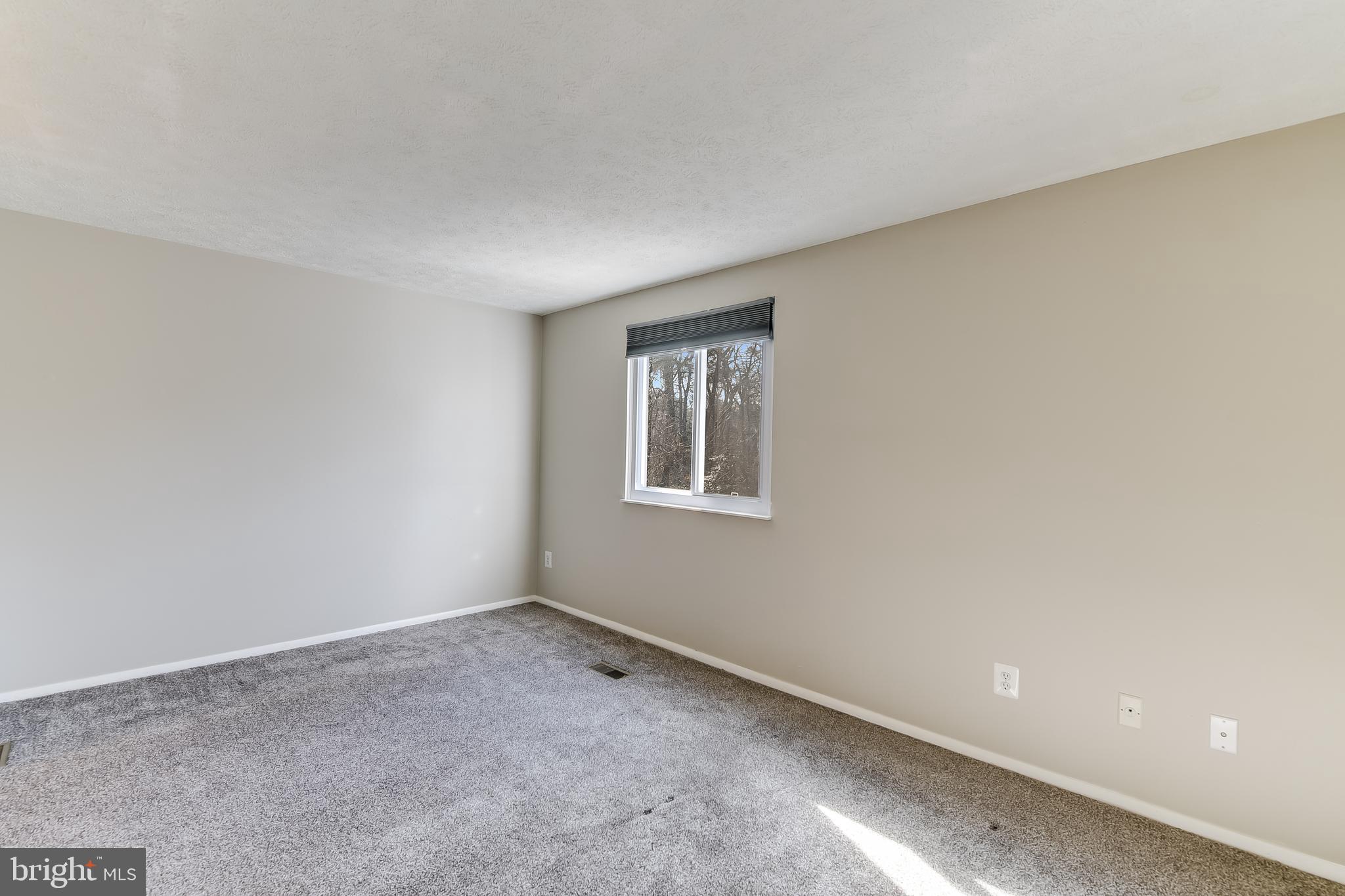 7946 Sutherland Court Pasadena, MD 21122 - Photo 27 of 37 a view of an empty room with a window