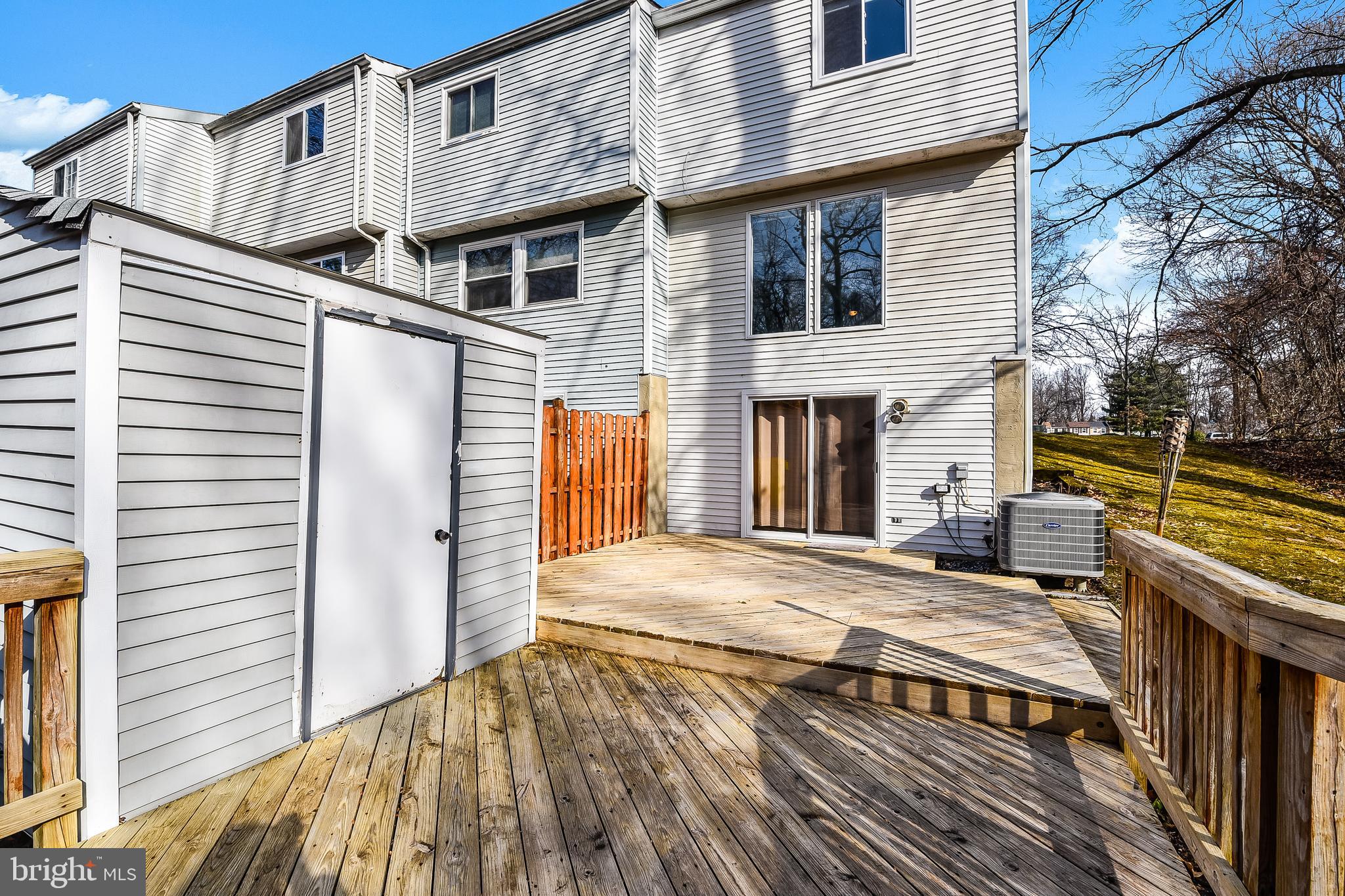 7946 Sutherland Court Pasadena, MD 21122 - Photo 4 of 37 a view of a house with a wooden deck
