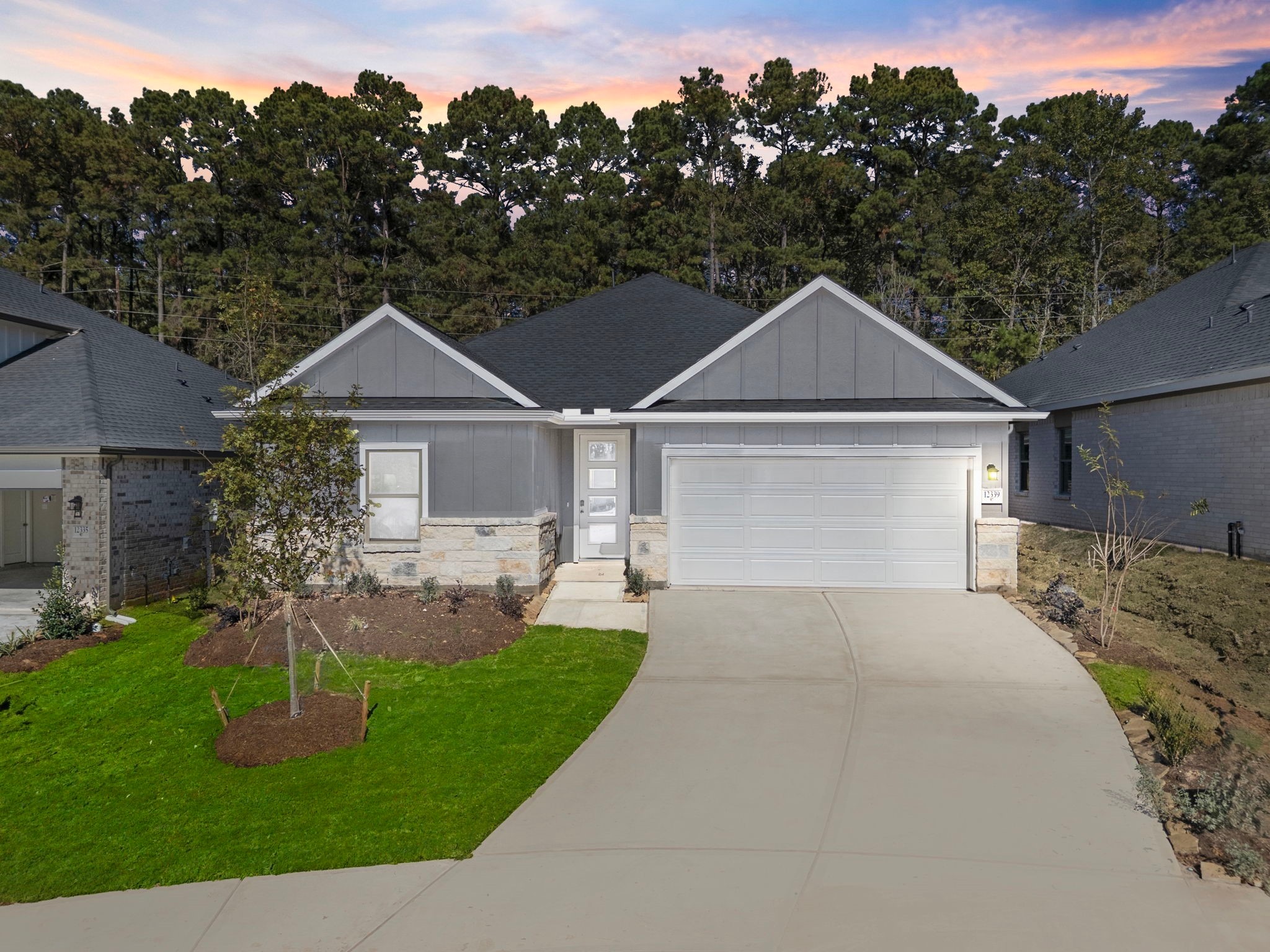 12339 Ridge Top Drive Conroe, TX 77304 - Photo 1 of 29 a front view of a house with a yard and green space