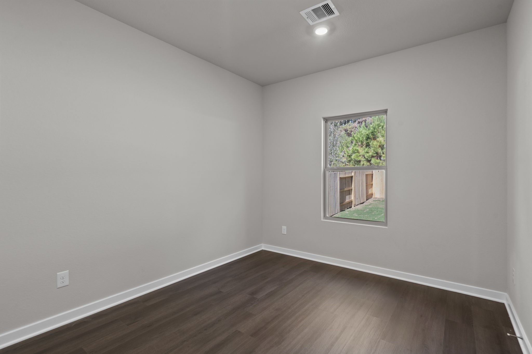 12339 Ridge Top Drive Conroe, TX 77304 - Photo 11 of 29 an empty room with a window