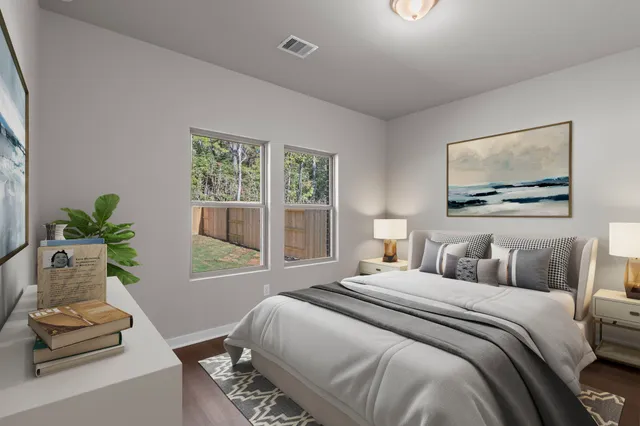 a bedroom with a bed and a couch