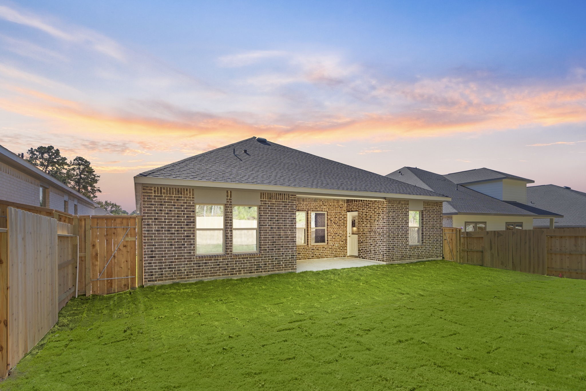 12339 Ridge Top Drive Conroe, TX 77304 - Photo 21 of 29 a front view of a house with a garden and yard