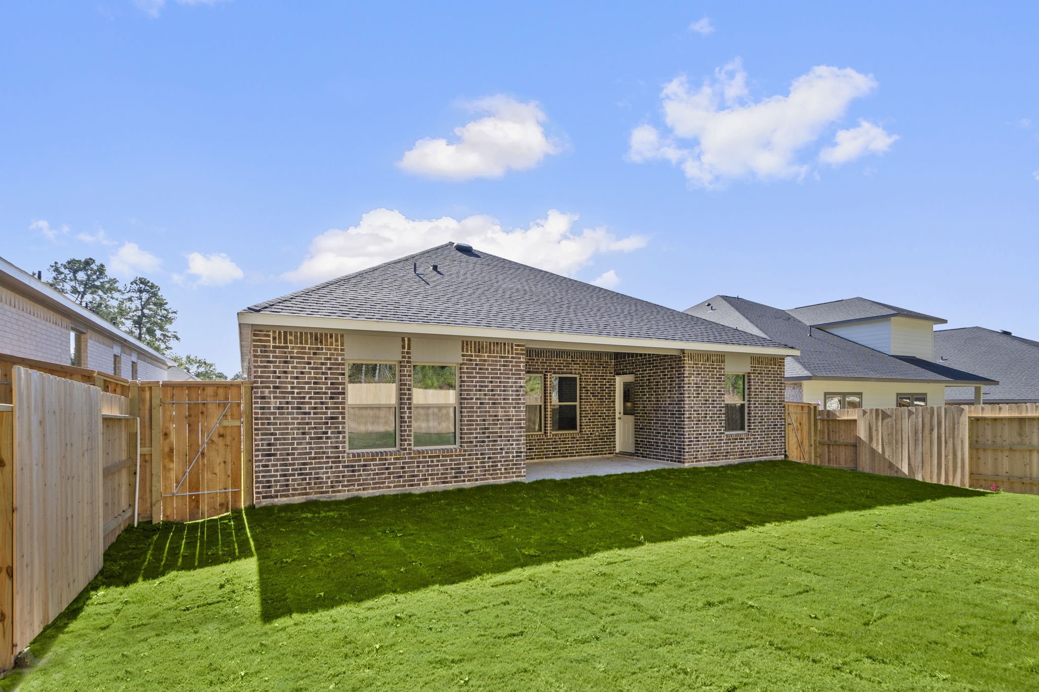 12339 Ridge Top Drive Conroe, TX 77304 - Photo 26 of 29 a view of a house with a yard