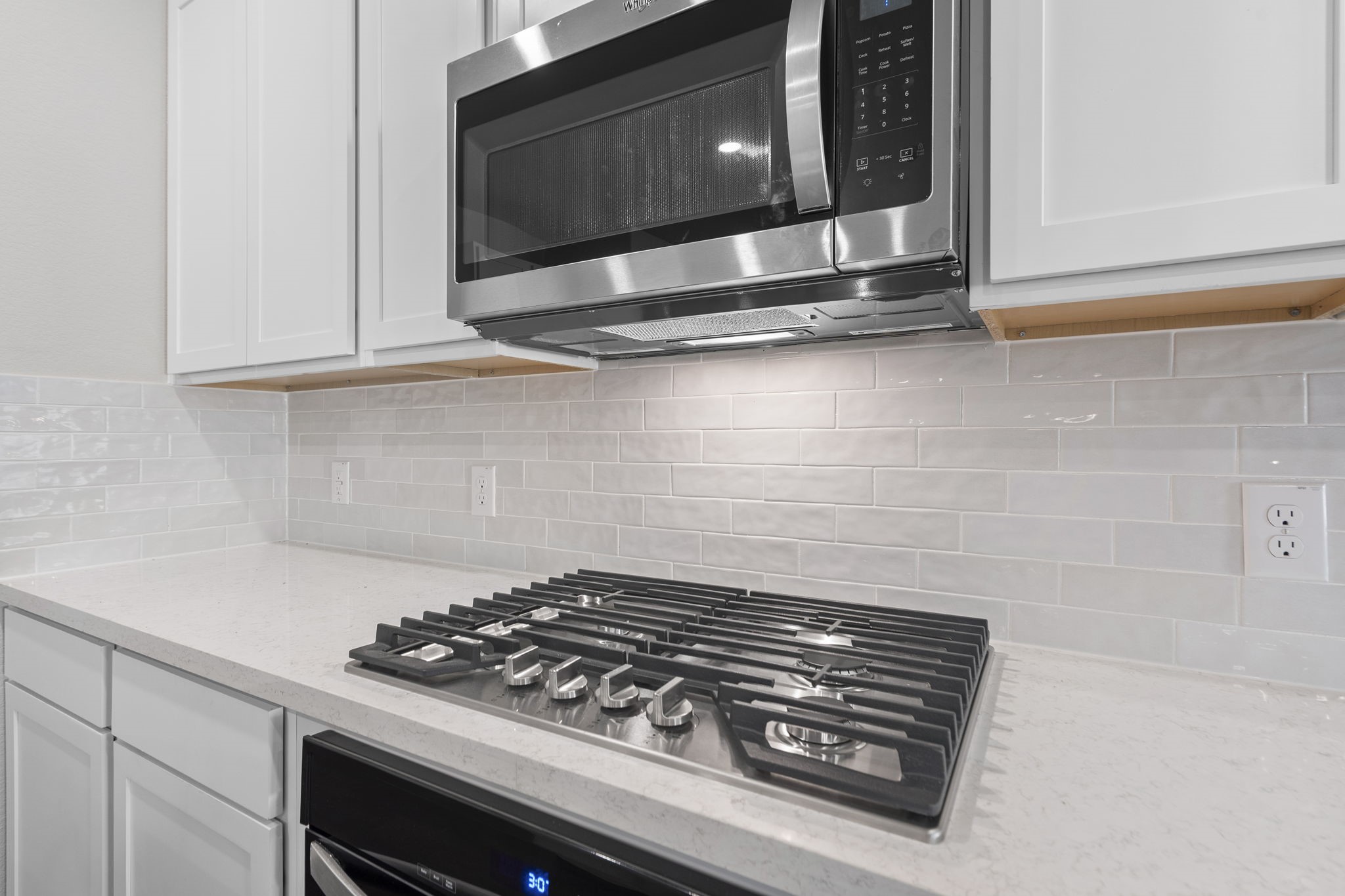 12339 Ridge Top Drive Conroe, TX 77304 - Photo 6 of 29 a stove top oven sitting inside of a kitchen