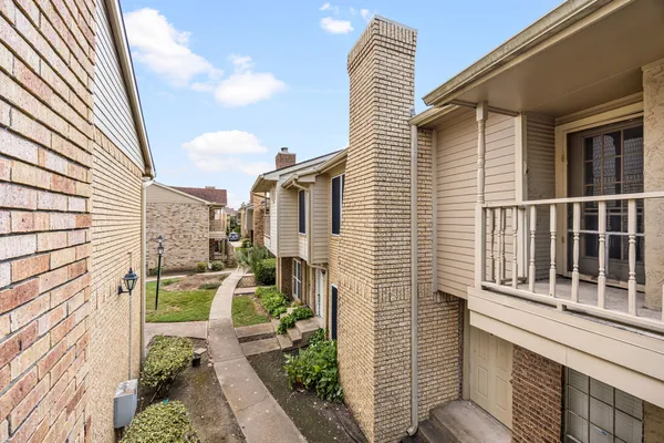 a balcony view with a large window