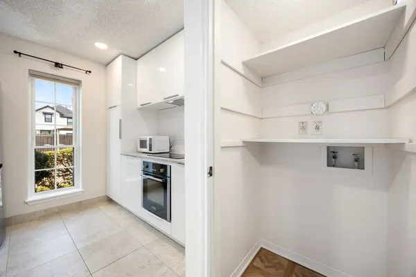 a kitchen with stainless steel appliances granite countertop a refrigerator and a stove