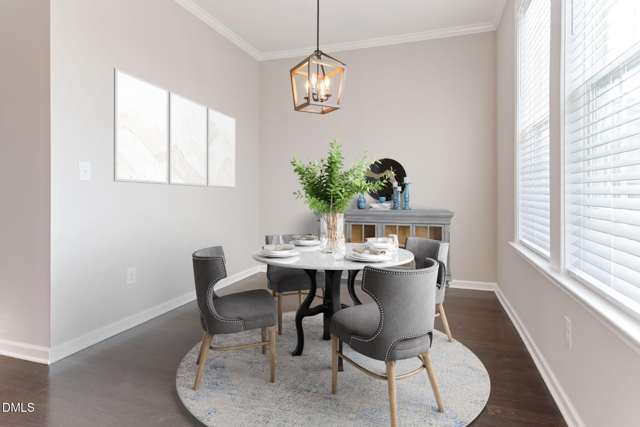 5916 Giddings Street Raleigh, NC 27616 - Photo 14 of 49 a dining room with furniture a potted plant and a window