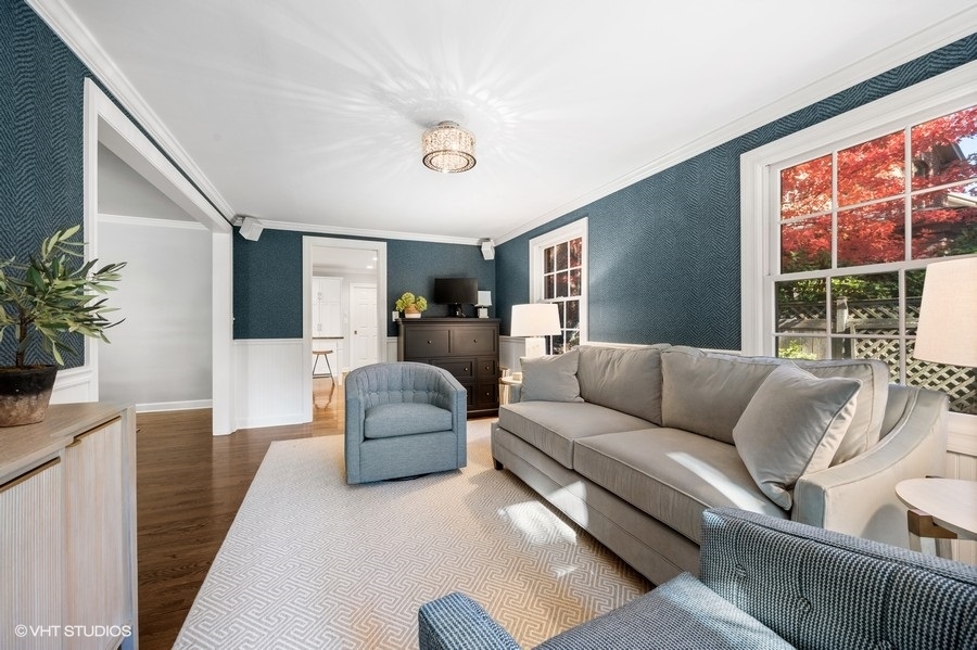 915 Golfview Road Glenview, IL 60025 - Photo 12 of 31 a living room with furniture and a large window