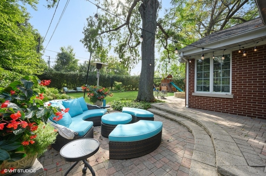 915 Golfview Road Glenview, IL 60025 - Photo 24 of 31 a view of a chairs and table in backyard of the house