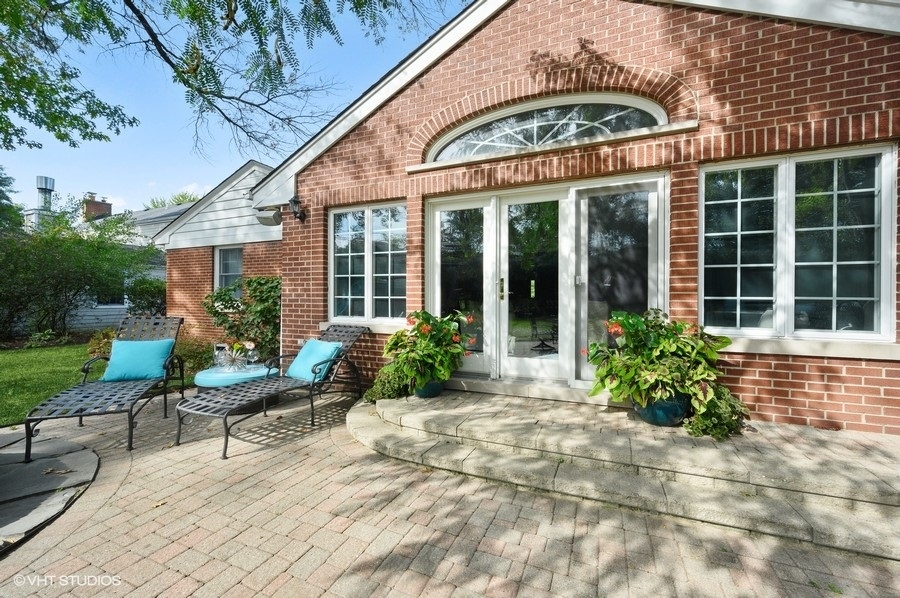 915 Golfview Road Glenview, IL 60025 - Photo 27 of 31 a view of a house with backyard sitting area and garden