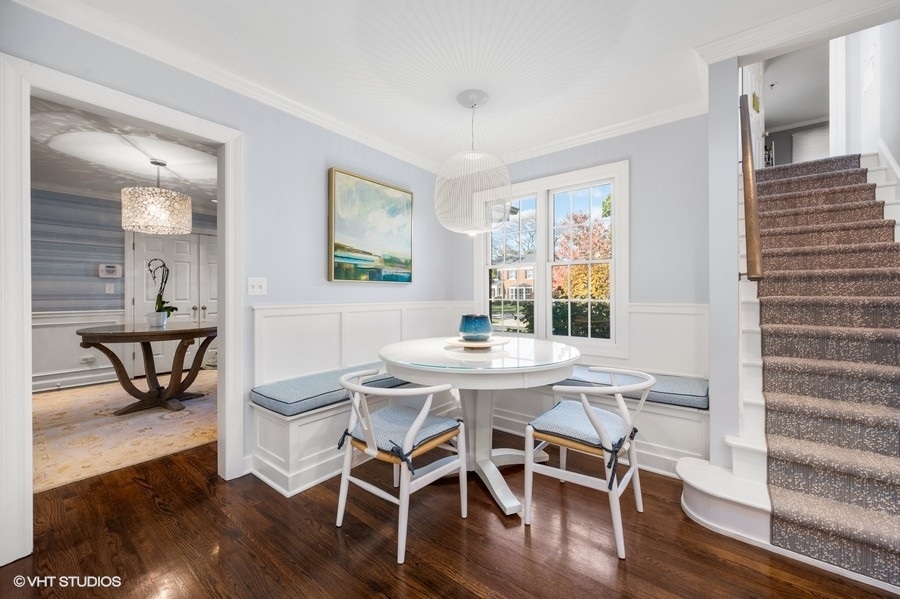 915 Golfview Road Glenview, IL 60025 - Photo 10 of 31 a view of a dining room with furniture window and wooden floor