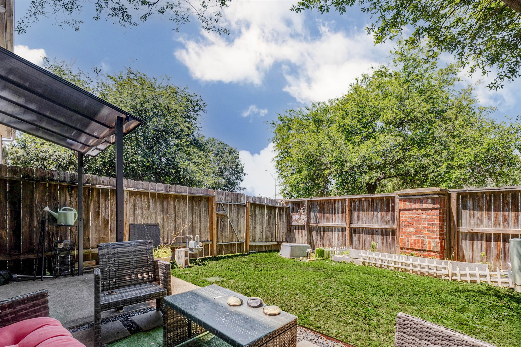 14522 Durham Chase Lane Houston, TX 77095 - Photo 34 of 40 a view of a backyard with couches plants and wooden fence