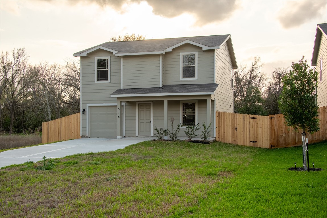 515 16th Street Hempstead, TX 77445 - Photo 2 of 23 a view of a house with a yard and a garden