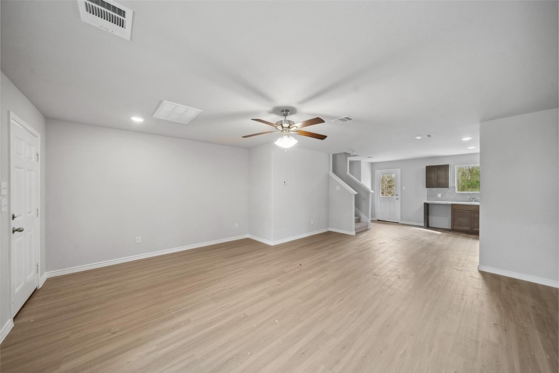 515 16th Street Hempstead, TX 77445 - Photo 7 of 23 wooden floor in an empty room with a window