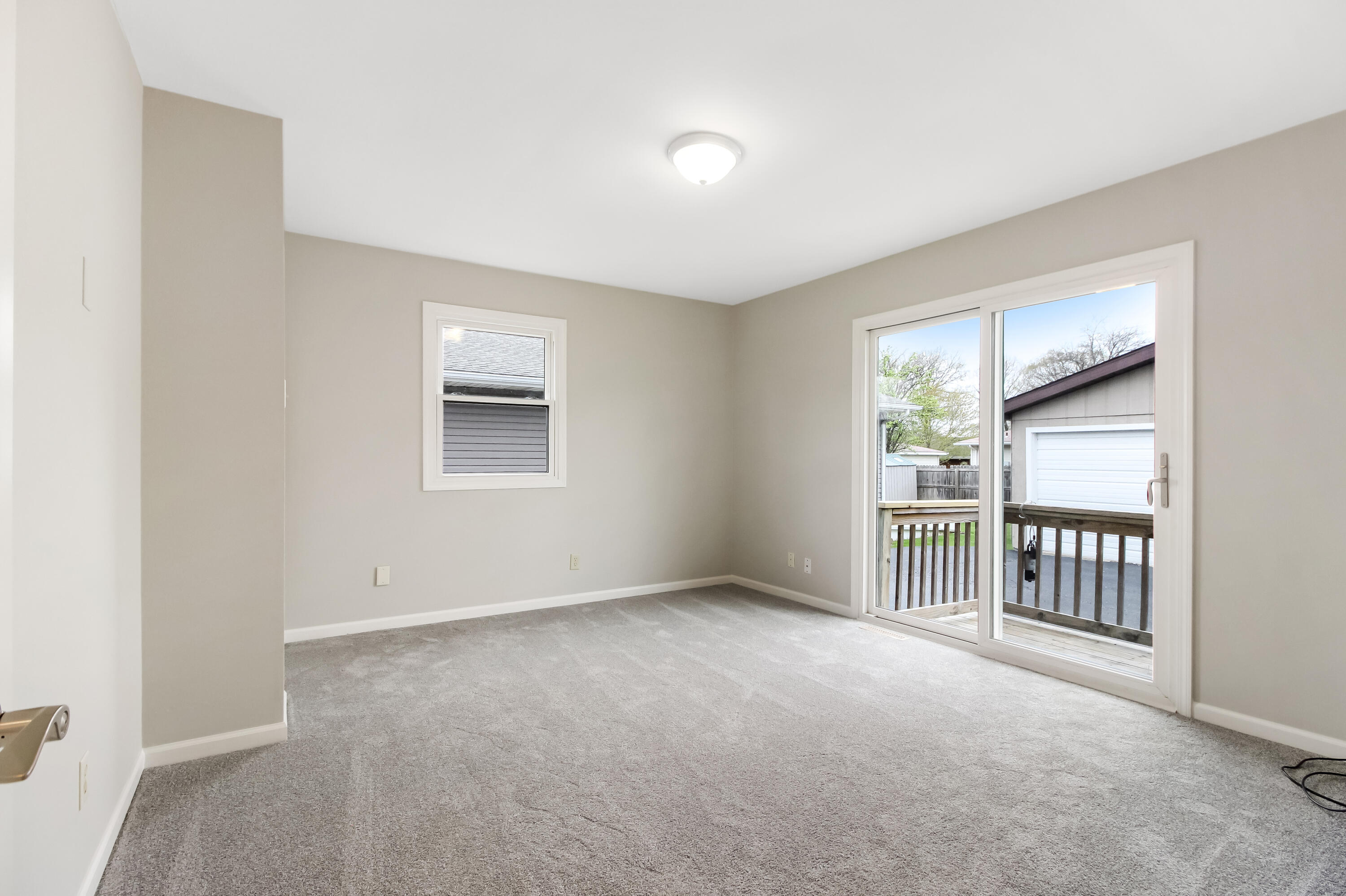 7348 West 83rd Place Crown Point, IN 46307 - Photo 11 of 14 a view of an empty room with a window