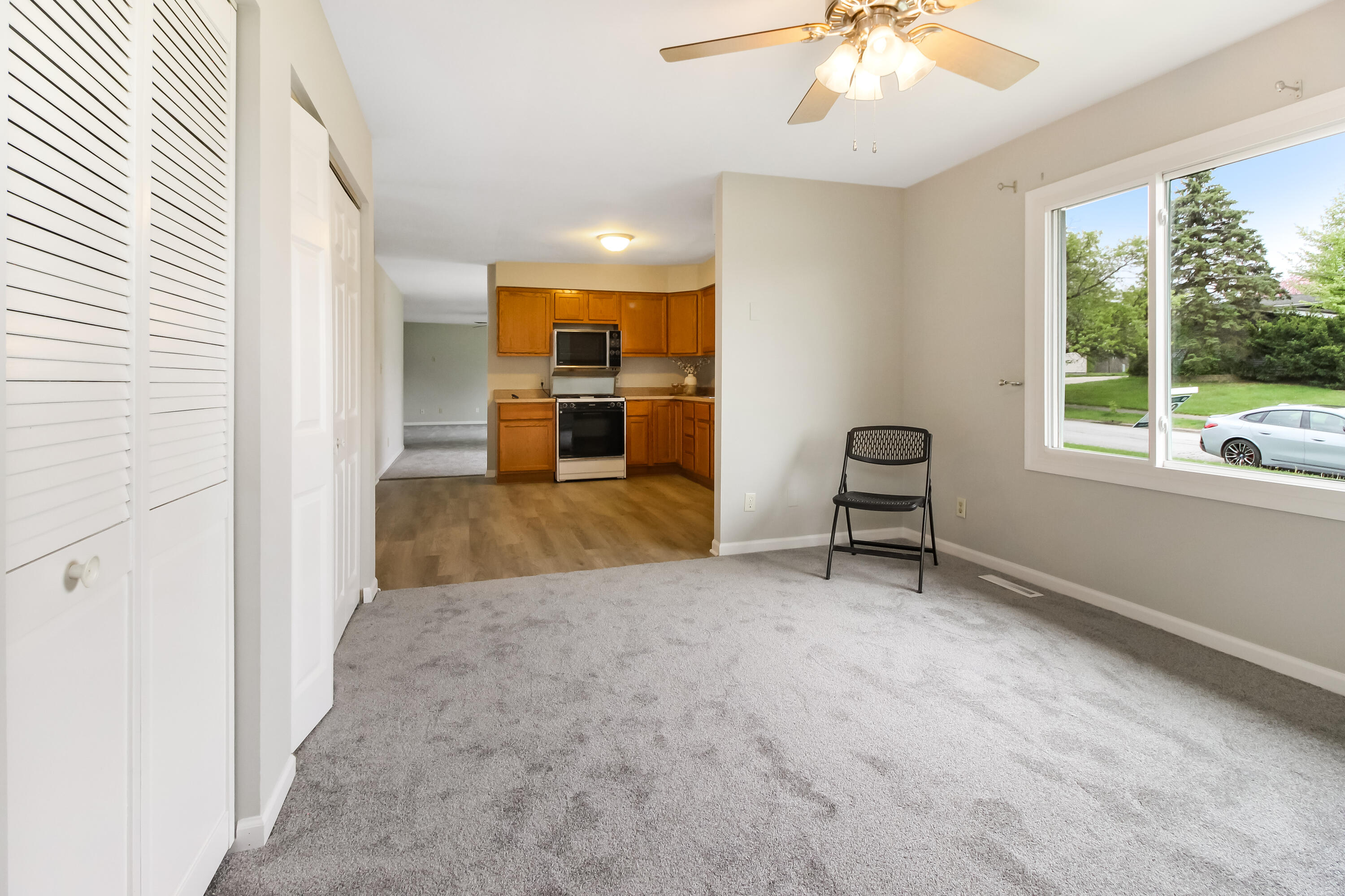 7348 West 83rd Place Crown Point, IN 46307 - Photo 14 of 14 an empty room with windows and ceiling fan