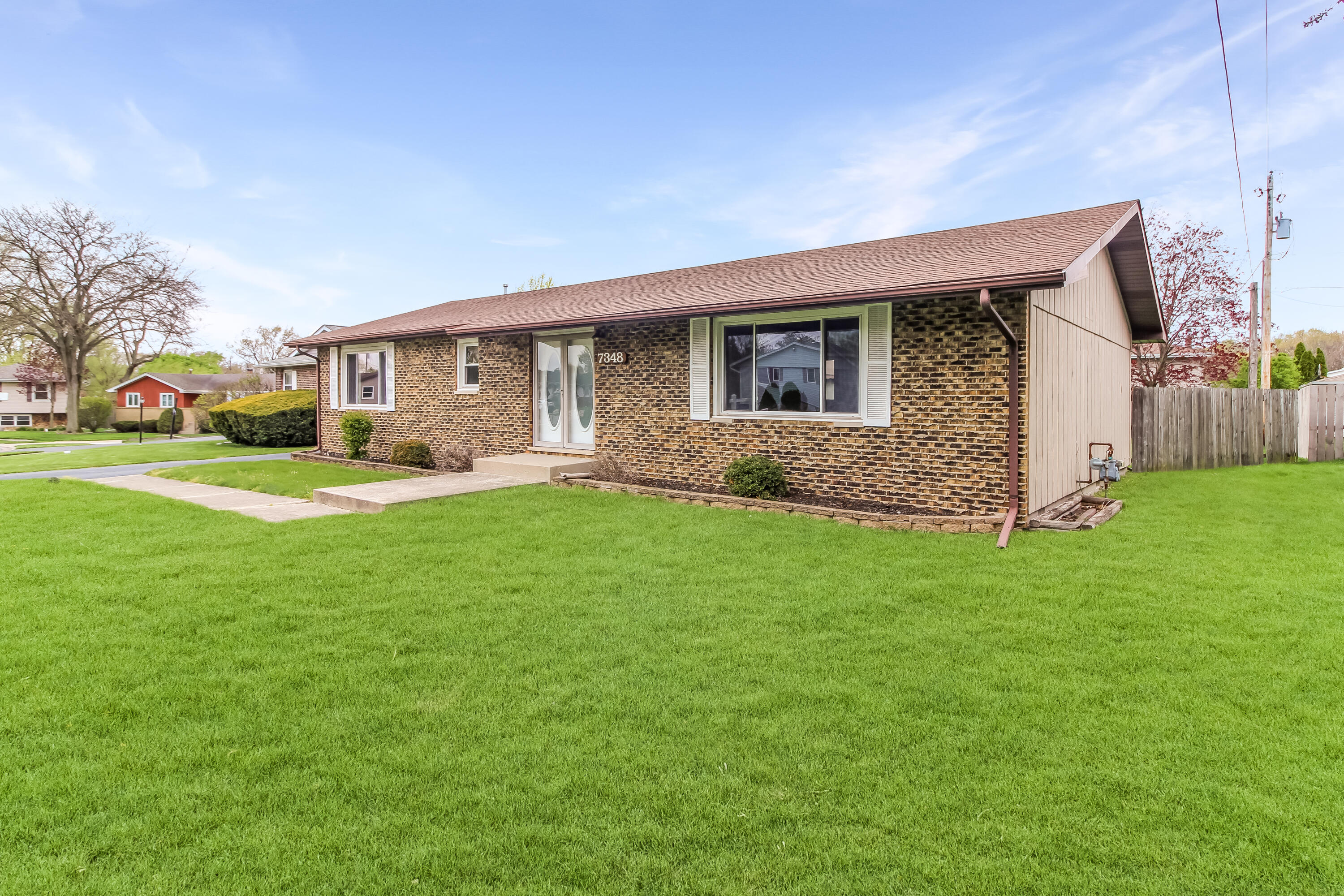 7348 West 83rd Place Crown Point, IN 46307 - Photo 2 of 14 a front view of house with yard and green space