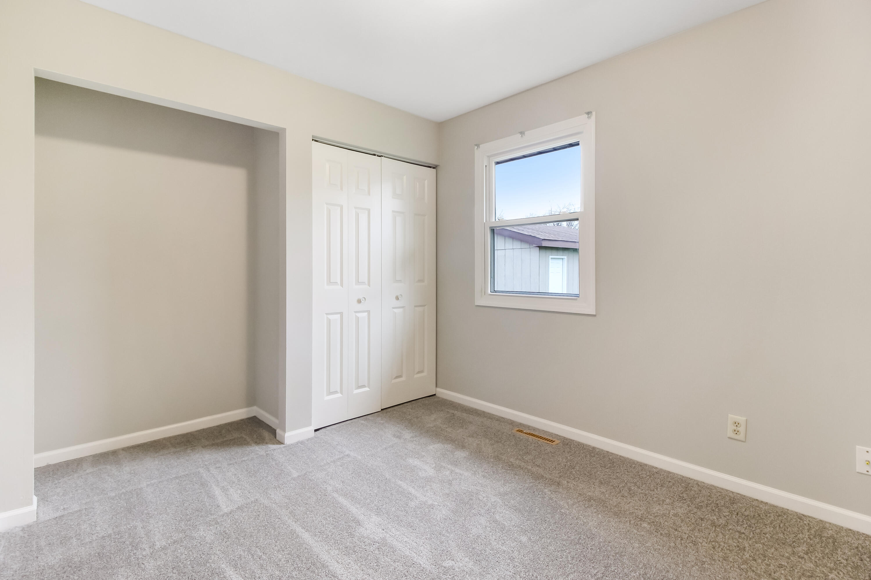 7348 West 83rd Place Crown Point, IN 46307 - Photo 7 of 14 an empty room with windows and closet