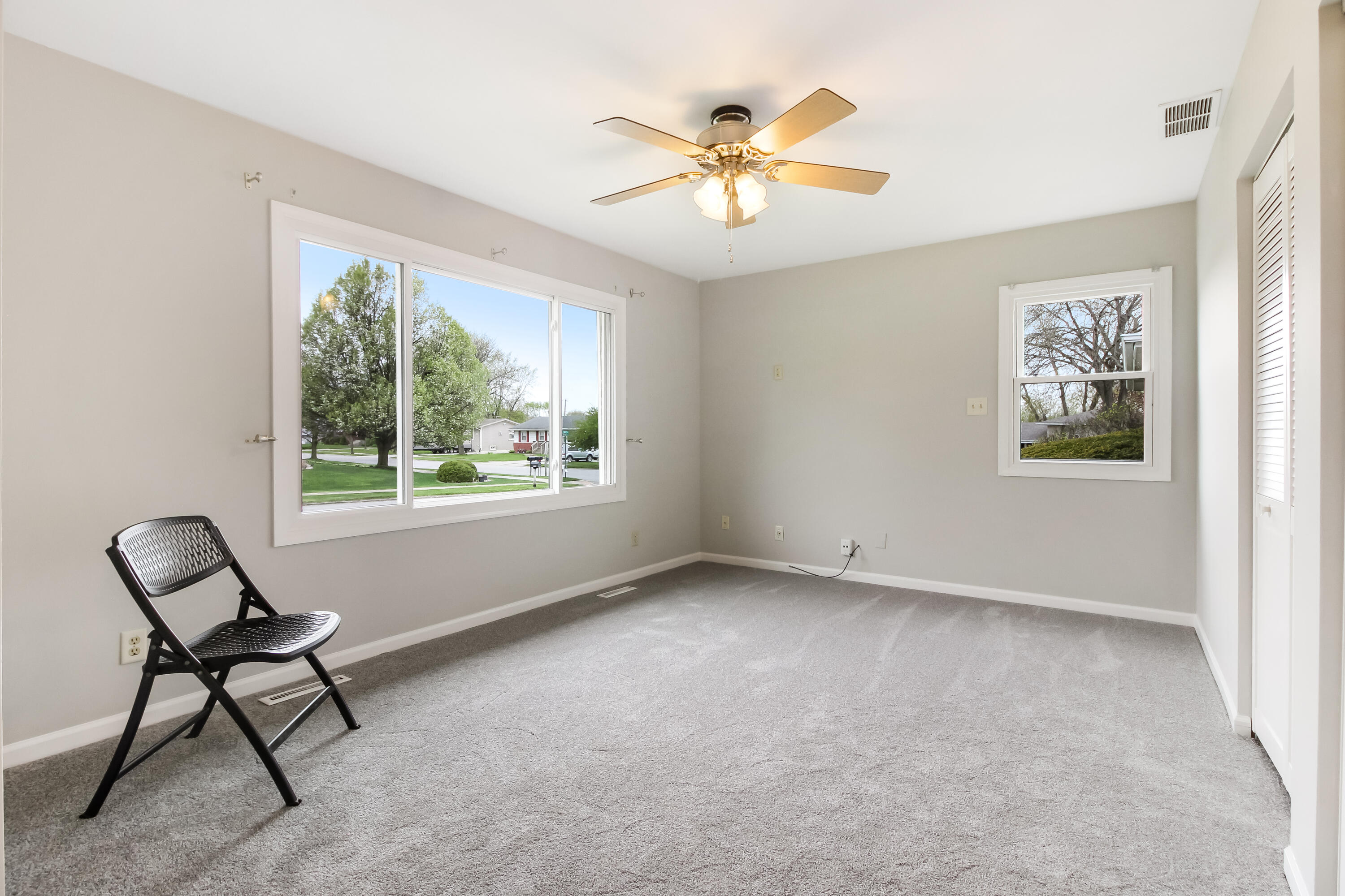 7348 West 83rd Place Crown Point, IN 46307 - Photo 9 of 14 a view of livingroom with furniture window and a ceiling fan