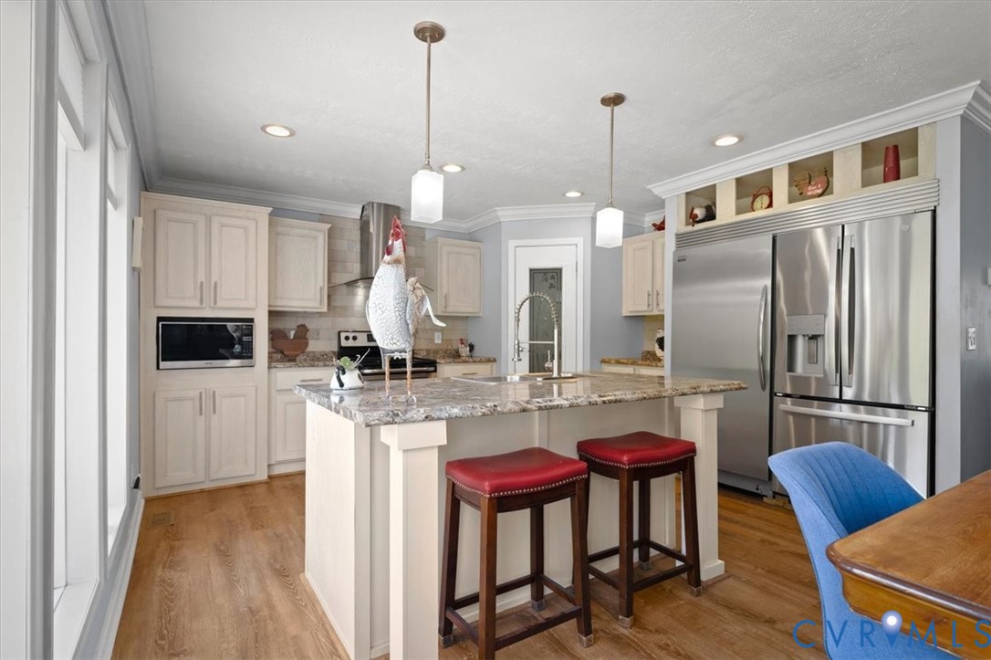 2181 Mill Quarter Road Ford, VA 23850 - Photo 15 of 56 Kitchen island with an integrated sink and pendant