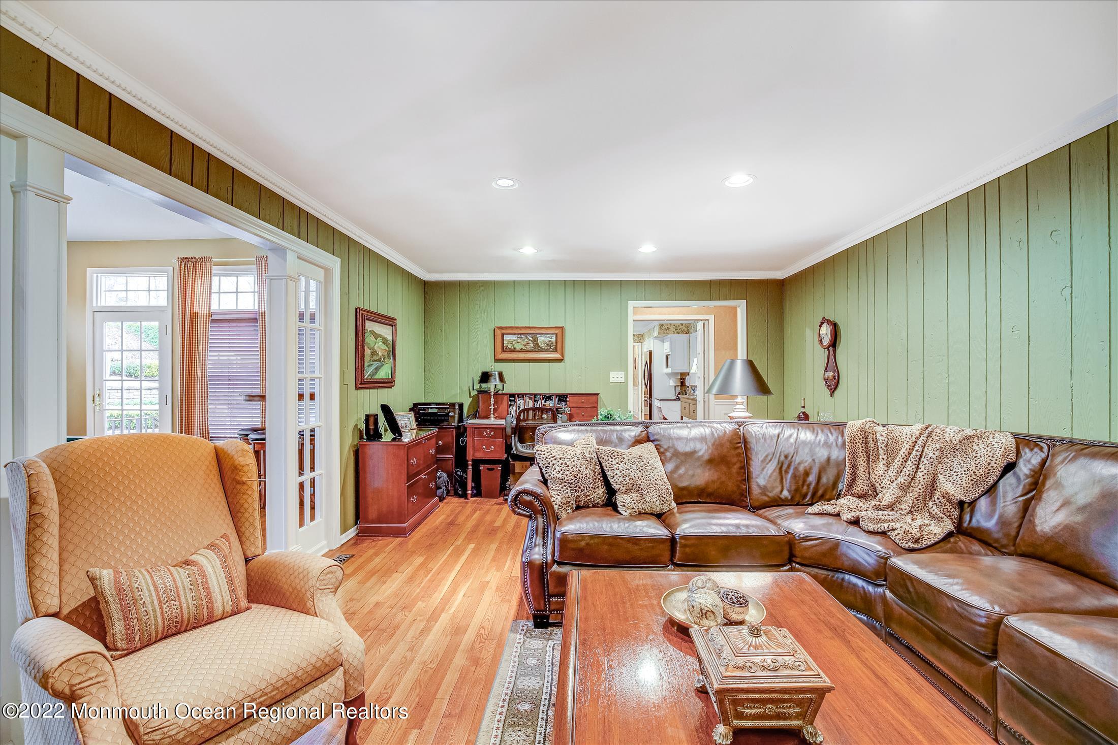 45 Ruby Drive Morganville, NJ 07751 - Photo 16 of 47 a living room with furniture wooden floor and a window