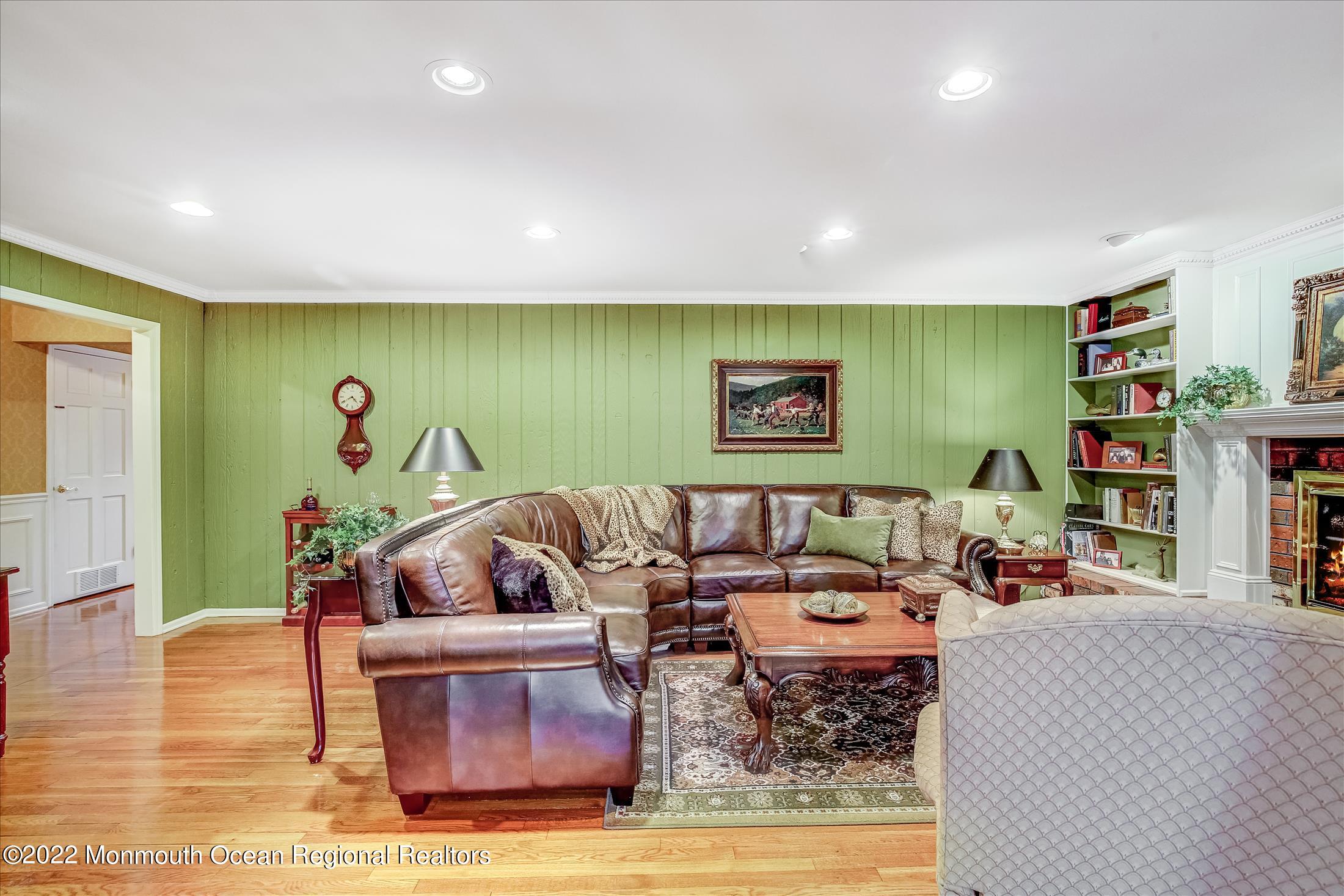 45 Ruby Drive Morganville, NJ 07751 - Photo 18 of 47 a living room with furniture and a flat screen tv