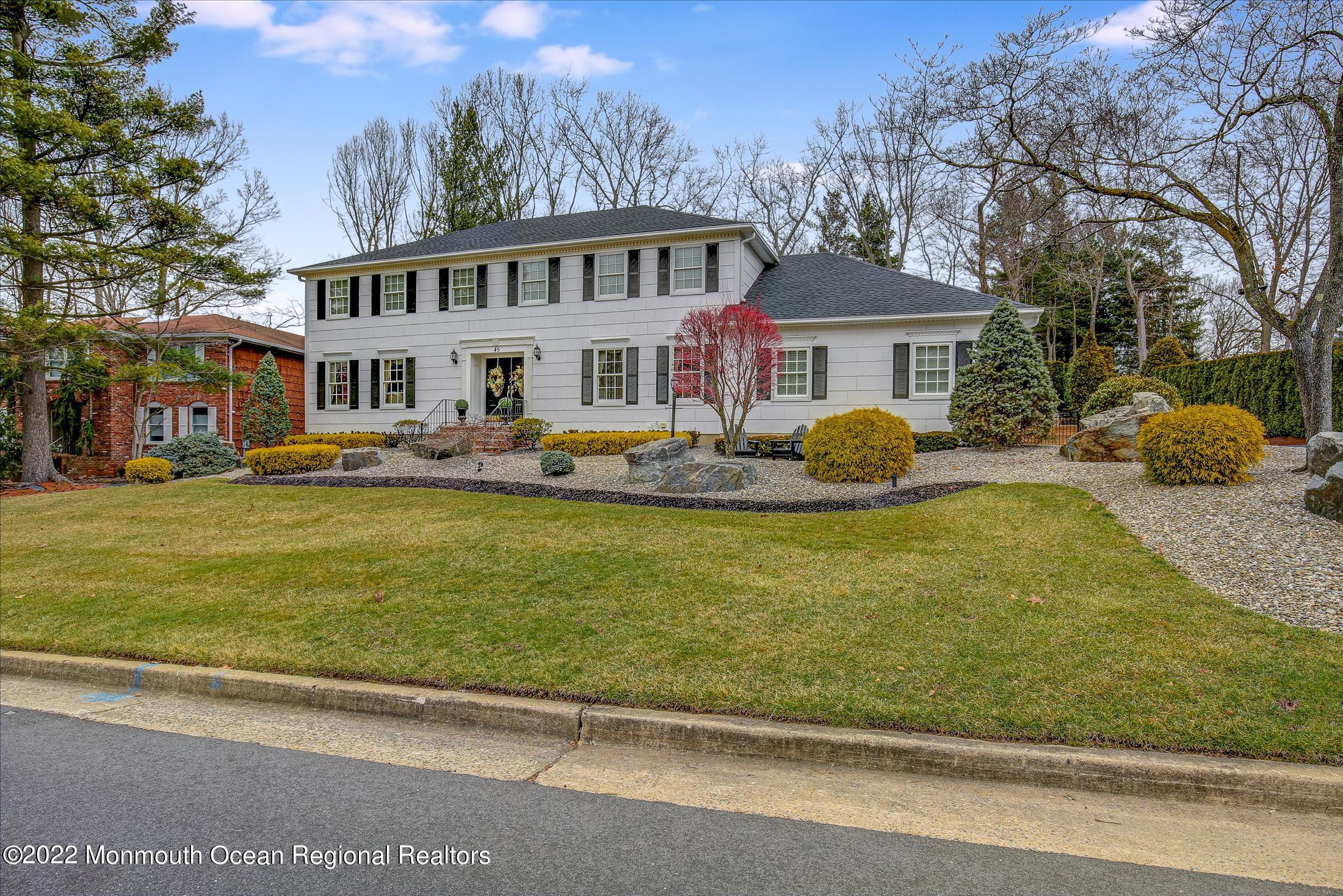 45 Ruby Drive Morganville, NJ 07751 - Photo 2 of 47 a front view of a house with garden